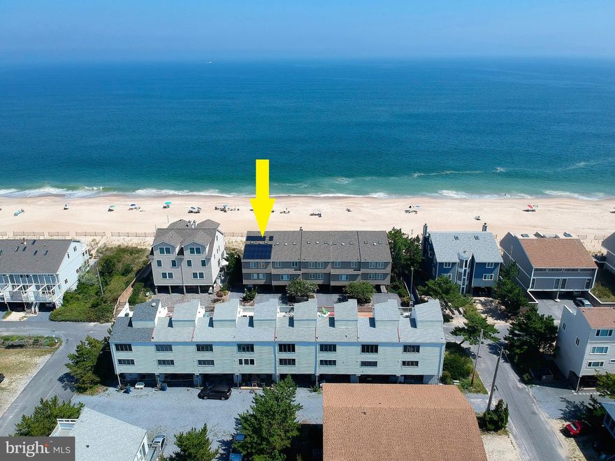 Step off your oceanfront deck directly onto one of the finest stretches of beach along the Delaware coast from this stunning Oceanfront end townhome with unparalleled views of the Atlantic from every level! This exceptional property has been meticulously maintained and completely updated with fine finishes and features throughout including a beautiful kitchen with sleek gray cabinetry, granite countertops, and a large center island with seating. Enjoy breathtaking sunrises over the Ocean from any of the 3 waterfront decks. An outdoor shower and secure storage room on the ground level make cleaning up after a day on the beach a breeze. Additional conveniences include solar panels that significantly reduce the cost of electricity, an electric vehicle charger in carport, and storm shutters for added protection and peace of mind while you are away. Offered fully furnished, this impressive home is ready to be enjoyed this summer. Positioned in the desirable Four Winds location of Tower Shores, this property’s direct beach access is a rare find!