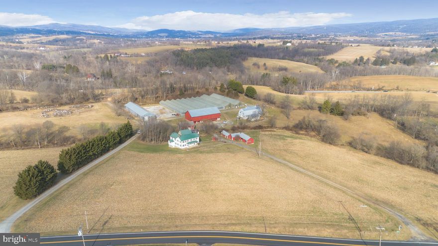 Love history?  Love farming?  Love Middletown Valley?  This trifecta is for YOU!  Once a bustling nursery, this 37 acre farm in the heart of the valley offers so many possibilities!  Starting with the original 1809 stone house, with the cold cellar, original cooking hearth and spring-fed well… it’s a step back in time for any history enthusiast.  Phase two for this 1800s farm family was the pre-Civil War log cabin, comprised of the right side of the farmhouse.  The final phase was the later 1800s farmhouse addition and finally the 2 story carport connecting it all together.  Keeping with the authentic charm, the house offers original pine floors, wide thresholds and the initial lower-level cooking fireplace with utensils.  For modern day living, the professionally designed gourmet kitchen was recently completed with a 10 foot Quartz island, stainless steel appliances with Forno 8 burner gas stove, wine fridge, farm sink, casement showcase window, pantry, accent lighting and display cabinets.  It’s the perfect space for entertaining or any culinary work-of-art.  In addition to the exceptional kitchen, both full bathrooms were completely renovated, adding to the contemporary appeal.  Metal roof, replacement windows, main level laundry room and pull down attic for additional storage space.  This prime real estate includes three natural springs, recently improved commercial grade greenhouses with new doors and shutters, a bank barn with horse stalls, dairy barn with upstairs office rooms, kitchenette, 2 bathrooms (as is) and its own septic.  There’s also a tractor barn, pig barn, chicken coop, multiple shed buildings and plenty of pasture.  Finalized with a picturesque creek running through the property and a back lot with amazing western sunsets.  2730 Marker Road is truly one-of-a-kind!
