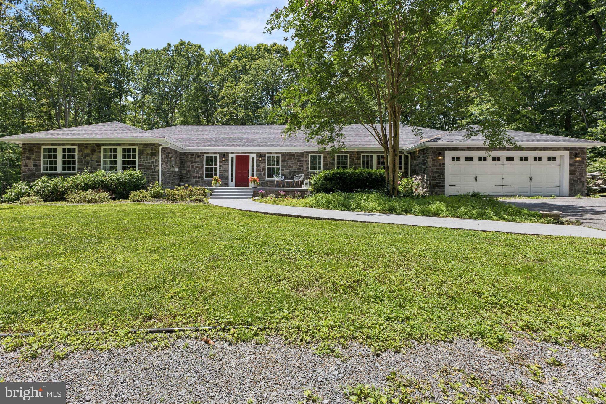 Welcome to your private retreat in a spectacular location in Northern Calvert County! Close to schools, shopping and commuter routes. Nestled on 5 serene acres, this beautifully maintained elegant rambler offers over 3,100 finished square feet of comfortable living space, including a fully finished walk-out basement. Inside, you'll find 3 spacious bedrooms, 3.5 bathrooms, and a flexible office/possible 4th bedroom—perfect for remote work, home schooling or guests. The stunning, light-filled family room features a wall of four sets of gorgeous glass doors, custom built-ins, and a cozy gas fireplace, all overlooking the expansive maintenance free Trex deck—ideal for entertaining guests or relaxing in privacy and nature. The cook’s kitchen boasts granite countertops, stainless steel appliances, and a pantry for ample storage. Retreat to the luxurious primary suite with a massive, tiled shower and an oversized custom walk-in closet. Stunning hardwood floors add warmth and sophistication throughout. Additional highlights include a brand-new roof (2023), an oversized two-car garage, and an impressive three-story barn-style storage building with electric. With generous space, unmatched privacy, and room to create the lifestyle you’ve been dreaming of, this property is truly one of a kind! Schedule your showing today before it is gone!