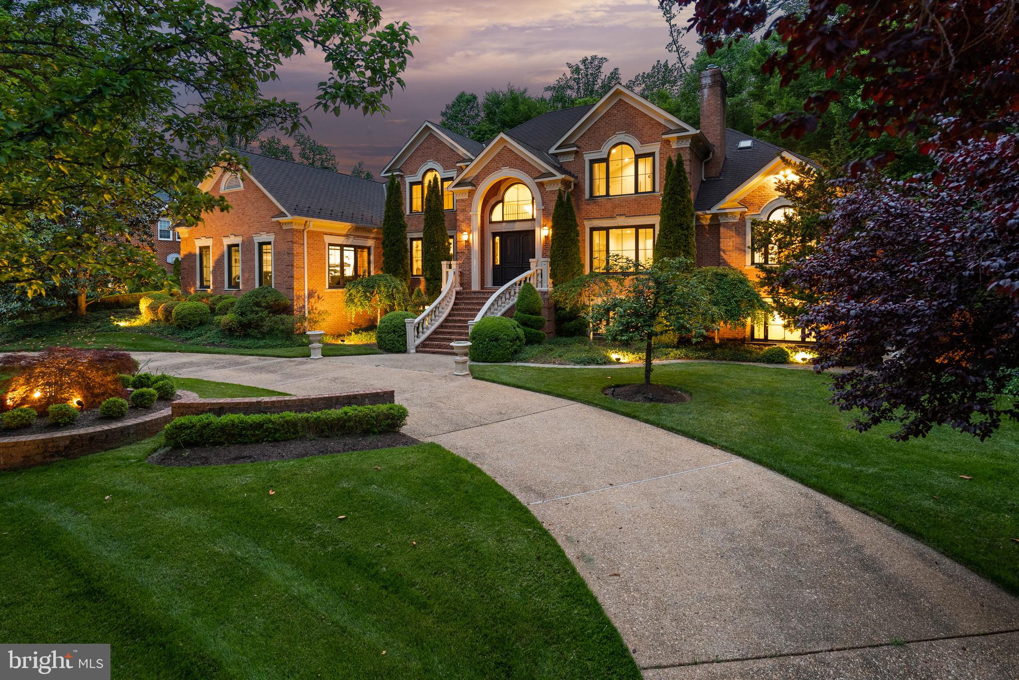 Meticulously Reimagined McLean Estate
Positioned on a quiet cul-de-sac in the heart of McLean, just moments from Tysons Corner, this exquisitely reimagined, gated estate is the pinnacle of privacy, sophistication, and modern luxury. Every element of the comprehensive renovation was chosen with the utmost discernment—Pella windows, custom doors, designer lighting, and modern bespoke finishes—resulting in a residence of rare quality, craftsmanship, and style.
At the heart of the home, the open-concept floorplan begins effortlessly in the stunning, Porcelanosa-designed kitchen. Here, the most discerning chef will discover professional grade appliances including a SubZero refrigerator and freezer, Wolf range, Sharp microwave drawer, a Zip water system, and a climate-controlled wine display. The kitchen flows seamlessly to the expansive pantry, dining area, and the great room with a 20’ soaring ceiling and majestic fireplace overlooking the expansive gardens and pool. An adjacent formal dining room provides the perfect venue for grand entertaining.
Nearby, the newly added screened-in porch with skylights, integrated firepit, and roll-down shutters creates a year-round retreat. The formal living room anchored by a second fireplace and the private library, enclosed with custom glass partitions, also overlook the resort-style pool for a tranquil yet inspiring work-from-home setting.
Just beyond, the main level primary suite is a sanctuary unto itself, featuring soaring ceilings, couture-inspired, dual dressing rooms with custom floor to ceilings built-ins and lighting, and an expansive, spa-quality bathroom with Porcelanosa vanities. Dramatic windows overlook the pool and gardens bringing the serene landscape indoors to this suite.
Upstairs, three additional bedrooms suites are thoughtfully appointed with cathedral ceilings, designer accent walls and en-suite skylit baths featuring operable Velux windows. A luxurious guest suite offers the flexibility of a second primary with a large closet and a generous en-suite bath.
Downstairs, more luxurious surprises await. The walk-out lower level is flooded with natural light from large windows with views across the front gardens. The extensive renovation included the addition of a fully equipped in-law apartment suite with a separate entrance, its own kitchen and expansive living area as well as a large ensuite bathroom. Just beyond, a professional-grade gym, recreation, and game rooms yields expansive space for entertaining all ages.
Outdoors, the resort-style backyard is a private oasis featuring a newly installed, heated saltwater infinity-edge pool and spa by Lewis-Aquatec. Lush professional landscaping encircles the garden providing an oasis of outdoor luxury. Additional premium amenities include an oversized, 3-car garage with 2 Tesla chargers, a Generac generator, commercial-grade WiFi, a state-of-the-art security system with cameras, and enhanced exterior lighting. The entire estate is fully fenced and gated.
This is a rare, turnkey offering in one of McLean’s most discreet and prestigious enclaves. Completely reimagined and impeccably renovated to the highest modern standards, this estate offers elegance, comfort, and modern technology just minutes from the Nation’s capital.