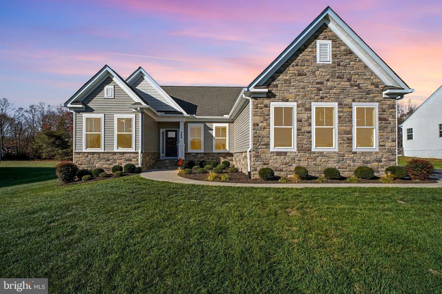 Welcome to this beautifully upgraded Chesapeake model ranch-style home, built by Atlantic Builders in 2021 and set on a private 1.5-acre lot in sought-after Liberty Hall Estates. Offering over 4,000 total square feet of living space (2,036 finished on the main level), this 3-bedroom, 3-bath home blends modern design, spacious one-level living, and premium custom upgrades throughout. 
Step inside to an open-concept layout featuring nine-foot ceilings, luxury vinyl plank flooring, and abundant natural light. The gourmet kitchen showcases a 79" x 51" quartz island, quartz countertops, upgraded 42" cabinetry, stainless GE appliances, and upgraded kitchen lighting, making it the perfect centerpiece for entertaining. The kitchen flows seamlessly into the extended family room, enhanced with a 4-foot rear extension and additional windows for a bright and welcoming space.
The private owner’s suite features a cathedral ceiling, spacious his and hers closets, and a luxurious en-suite bath with upgraded 13"×13" tile, elevated double vanity, brushed nickel fixtures, and a beautiful upgraded glass shower door. The two additional main-level bedrooms include brushed nickel light fixtures. 
The partially finished basement, full bathroom, double-wide basement exit, and large open lower level offer excellent potential for future finishing or recreation space. The home also includes quartz counters in all three bathrooms, upgraded lighting throughout, and extra recessed lighting in the living area.
Outdoor living is just as impressive with a 20’×20’ paved parking pad, professional landscaping (per builder package), and a quiet setting. The oversized 3-car garage features durably finished and painted drywall.
This home offers the perfect combination of peaceful acreage living with modern comfort, thoughtful upgrades, and exceptional Atlantic Builders craftsmanship. Located minutes from shopping, dining, I-95, and commuter options. Don’t miss your chance to own this immaculate, move-in-ready home!