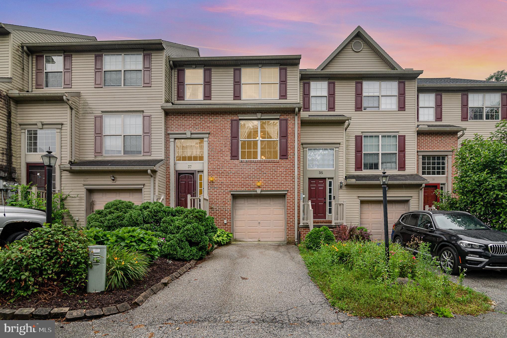 Located just minutes from shopping and Codorus State Park, this well-maintained 3-bedroom, 2.5-bath brick-front townhouse on Zachary Drive offers a quiet setting off the main townhouse community, allowing for extra parking and a more peaceful atmosphere. Inside, you'll find hardwood floors throughout, a spacious layout with a large owners' suite, and a bright, expanded dining area off the kitchen that opens to a fenced backyard and deck—perfect for relaxing or entertaining. The kitchen includes a pantry, and all bedrooms are equipped with ceiling fans. A one-car garage adds convenience, and the front yard is beautifully landscaped, creating a warm and welcoming first impression.