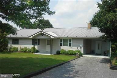 Motivated Seller, Reduced Price! 3+ Acres, Country setting surrounded by farmland, no close neighbors on a lightly traveled state maintained road w/easy access to Rt 50, Plenty of room on main & there is room to finish additional rooms in walk out lower level, loads of storage, deck w/mountain views, fenced pasture, several farm buildings w/storage, some w/electric, above ground pool, no HOA fee