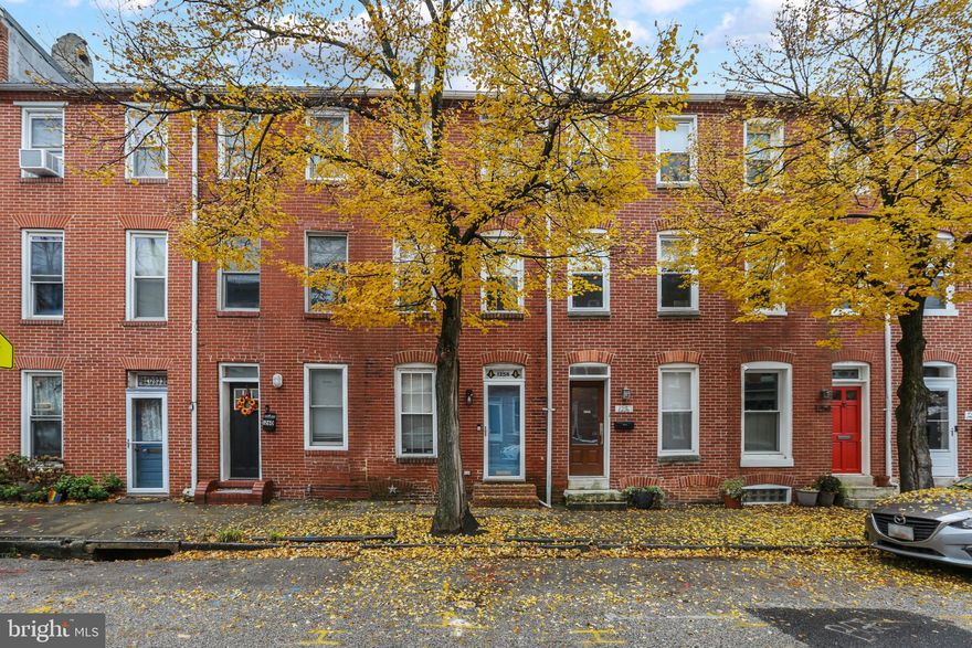 Spacious 3 bedroom, 3.5 bath home in Federal Hill with Parking Pad! This home features exposed brick, hardwood floors, chair rail, crown molding and recessed lighting. White shaker cabinets, granite counters, and stainless steel appliances found in the kitchen. Two bedrooms, two full baths and laundry on second floor. Third floor with bedroom and full bath.  The latest updates to this home include a new roof, new roof deck and tie backs for the brick that are ALL under warranty. Also see the new water pump for the basement.