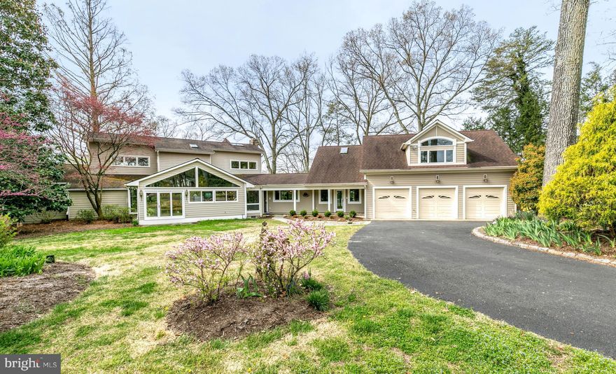 Welcome home to 365 South Drive where you can enjoy stunning views of Cattail Creek and the Magothy River throughout the house and along the oversized waterside deck. The kitchen has gorgeous upgrades including a custom island with multiple level granite countertops, alder wood cabinets, a wet bar with beverage and wine refrigerators and an oversized walk-in pantry with built-in shelving. Enjoy your morning coffee on the deck directly off the kitchen overlooking the water. This house is a prime spot for entertaining with the custom bar surrounding the living room and kitchen. The main level features two bedrooms with a Jack and Jill bath and an additional bath with a built-in sauna. There are two additional bedrooms on the upper level including the master suite with water views and an office/sitting room with walls of windows. As you make your way to the west wing, you access the atrium with a separate entrance and a full one-bedroom apartment. A private pier on Cattail Creek features 151  of waterfrontage, 7  MLW, 2 large boat slips, 12,500lb boat lift and water/electric on the pier. All of this is on a large, 1.3-acre lot with a detached 3-car garage, beautiful landscaping, multiple decks throughout the property, and even more details that you simply must experience for yourself. Come, See, and Stay a Lifetime.