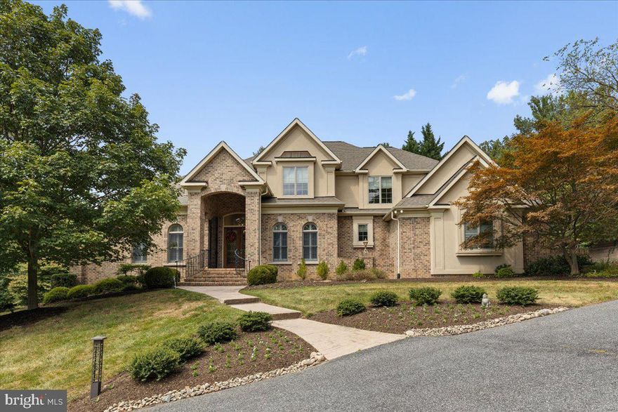 Prestigious Anton North   Where Luxury Meets Lifestyle
French-Inspired Estate | 5 Bedrooms | 4.5 Bathrooms |  approximately 7,000 Finished Sq Ft
Welcome to this elegant French-style estate, perfectly positioned on a private 1.27-acre lot in the prestigious Anton North community. Backing to serene woodlands and surrounded by lush landscaping, this exquisite residence offers approximately 7,000 square feet of finished living space, thoughtfully designed for both luxurious everyday living and high-end entertaining.
The main level showcases a dedicated home office with double doors, rich ceiling beams, and picturesque views, creating the ideal work-from-home environment. The gourmet kitchen is a chef’s dream, featuring upgraded countertops, a tile feature wall with pot filler, a large island, Viking stainless steel appliances, a Sub-Zero refrigerator, double oven, and a well-appointed butler’s pantry that connects to the formal dining room. Adjacent to the kitchen, the open-concept Family Room is filled with natural light from bay windows and features a cozy gas fireplace. A charming breakfast room and a spacious living room with soaring windows and views of the backyard add to the home's inviting character. A walk-in pantry and main-level laundry room provide added convenience.

The main-level primary suite offers a peaceful retreat with a luxurious spa-inspired bathroom, including double vanities, a walk-in shower, and custom-designed closets. Upstairs, you’ll find three generously sized bedrooms—one with a private ensuite and two that share a Jack & Jill bathroom, each with separate vanities for privacy.


The newly finished lower level adds approximately 2,290 square feet of exceptional living space, bringing both comfort and sophistication to this already impressive home. Designed with entertainment and lifestyle in mind, the space features a state-of-the-art home theater, a dedicated gym, and an expansive full bar outfitted with a sink, dishwasher, kegerator, refrigerator, custom shelving, and a striking brick accent wall. A cozy fireplace set against a dramatic stone wall adds warmth and ambiance, while stone post counters and a shiplap feature wall lend style and character. A spacious fifth bedroom—currently used as a home office—along with a full bathroom, provide added flexibility. Walkout access to the side yard completes the space, seamlessly connecting the interior to the outdoors.

The exterior is just as impressive, with a classic brick and stucco façade, a charming gazebo, and a beautifully designed patio added in 2021. The professionally landscaped grounds include a cascading pond and an underground sprinkler system that keeps the property lush and vibrant year-round. A side-entry four-car garage features updated doors, fresh flooring, and new paint, ensuring both form and function.

This home offers the perfect blend of classic elegance, modern upgrades, and luxurious comfort in one of the area's most sought-after neighborhoods.