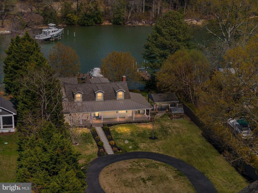 Welcome to 1862 Cedar Road — where waterfront living is done right.

Situated on 100 feet of deep-water frontage in a calm, deep water setting, this beautifully updated home offers 4 bedrooms and 3.5 bathrooms, including a first-level primary suite with heated floors and high-end finishes, plus a second main-level suite with private bath. Upstairs, two bedrooms feature spectacular water views.

The chef’s kitchen with upgraded appliances includes a prep island with additional sink and dual-zone wine refrigerator, flowing seamlessly into the dining area with a dedicated wet bar—perfect for entertaining.

A full stone, wood-burning fireplace (new stainless steel liner), hardwood floors throughout, and thoughtful updates add warmth and timeless appeal. 

Enjoy crabbing or fishing from your pier, quiet navigable waters, and stunning sunset views, all from the expansive wraparound porch.

Complete with a two-car garage and a convenient location near Pasadena and Annapolis, this home offers the perfect blend of comfort, quality, and waterfront lifestyle.