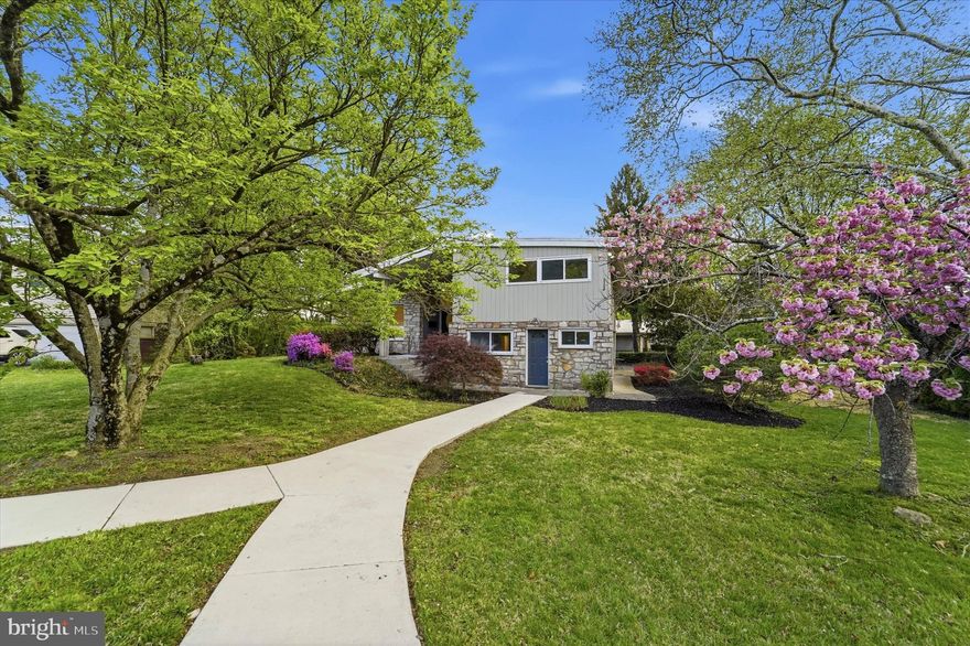 Discover 500 W Waverly Road in Glenside, a thoughtfully updated mid‑century modern home centered around a true private in‑law / au pair suite—an uncommon find in this coveted neighborhood. The suite enjoys its own entrance, full living room, kitchen, dining area, bedroom, and bathroom, delivering genuine independence and comfort for extended family, long‑term guests, or a tucked‑away professional retreat (all uses subject to zoning and township regulations). Upstairs, the main home features a bright, open layout that flows from the living room to the dining area and updated kitchen, ideal for effortless daily living and memorable gatherings. Step outside to a serene private deck along tree‑lined streets, a peaceful warm‑weather escape for morning coffee, grilling, or unwinding at the end of the day. The finished basement is already outfitted as a cinematic home theater, creating an immersive space for movie nights, big games, and entertaining, and could also function as a spacious future fifth bedroom or guest retreat if desired. With its blend of modern updates, highly flexible spaces, inviting outdoor living, and a walkable Glenside location close to parks, shops, and regional rail, this move‑in‑ready home is poised for its next owner to write the next chapter.