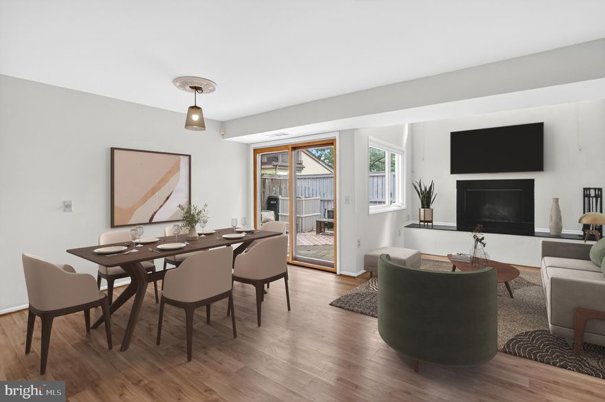 Welcome to this striking 3-bedroom, 2.5-bath contemporary townhouse in the Stella Vista condominiums, with access to select Columbia Association amenities. The home opens to a bright and airy two-story living room, centered around a charming wood-burning fireplace and filled with natural light. An adjoining dining area, with sliding doors to the rear patio, creates an effortless flow for entertaining both indoors and out. Freshly painted and finished with updated vinyl flooring throughout, the stunning finishes continue into the beautifully refreshed kitchen, showcasing white cabinetry with elegant gold handles, quartz countertops, a classic subway-tiled backsplash, and stainless steel appliances. Just off the kitchen, a pantry and laundry closet with newer stacked washer and dryer (2023-2024) provide everyday convenience, while another set of sliding doors leads directly to the patio, seamlessly extending the living space outdoors. A stylish powder room, added in 2022, features tiled flooring, trendy wallpaper, and a contemporary vanity with gold accents. Down the hall, the primary suite features a vaulted ceiling, wardrobe cabinet, and a beautifully renovated spa-inspired bath. Thoughtfully reconfigured in 2022, the bath boasts a dual-sink vanity, custom tilework, and a tub/shower combo—a rare and desirable feature within the community. Upstairs, you’ll find two generously sized bedrooms with ample closet space, along with an updated full bath (2022) that serves the upper level. Step outside to the fully paved and fenced patio with gate access to the community pathways offering a private retreat to create your own outdoor oasis. Additional updates include a new water heater (2024) along with upgraded light fixtures and door levers throughout. Parking is made easy with a dedicated carport space and plenty of visitor and additional parking nearby. Residents enjoy the perks of Columbia living, including access to select Columbia Association amenities such as neighborhood pools and fitness facilities. Ideally located, this home is just minutes from Howard Community College, Cedar Lane Park, Whole Foods, and Columbia Mall, with nearby lake views, shops, and dining in the vibrant downtown district.