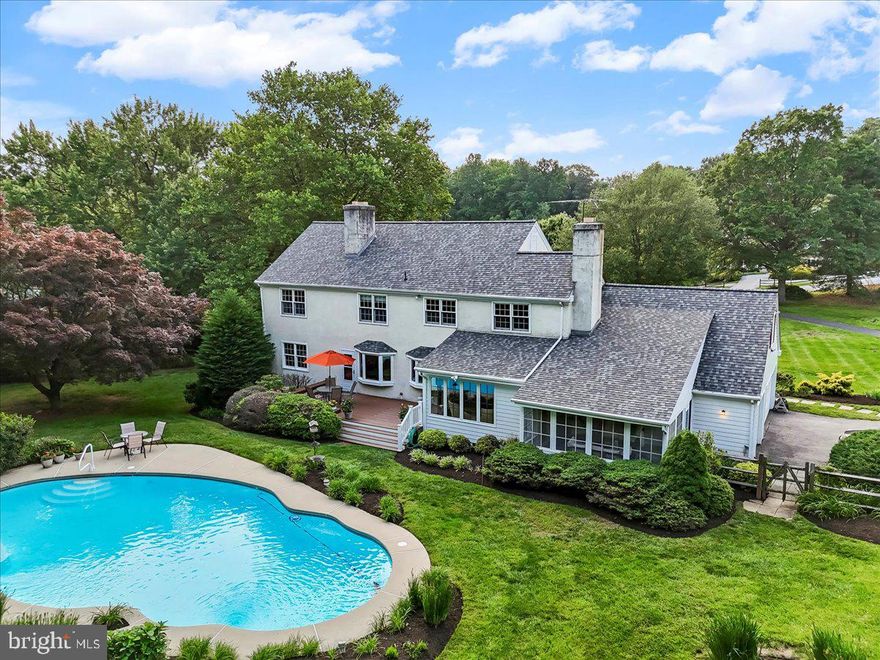 Welcome to 1771 Hunters Circle — a distinguished residence nestled within the coveted community of Wyllpen Farm in the heart of West Chester, Pennsylvania.  The original owners personally selected builder Jack Dorton to design and construct the home of their dreams-a magnificent estate where attention to detail is evident throughout.  Gracefully positioned on 2.8 pristine acres, this stately 5-bedroom, 2.5-bath home offers nearly 4,000 total square feet of refined living space, surrounded by mature landscaping, lush grass, and the quiet elegance of Chester County.  From the moment you arrive you will follow the curved driveway and notice a fieldstone façade, deep front yard, and expansive covered porch set the tone for a home where timeless character meets modern comfort.  Inside, rich hardwood floors, exposed beams, and curated millwork speak to the craftsmanship of a bygone era, while oversized bay windows bathe each room in natural light. Two fireplaces—including a dramatic double-sided hearth—anchor the main living areas with warmth and style.  At the heart of the home lies a thoughtfully designed kitchen—both functional and inviting—with abundant cabinetry, upgraded granite countertops, updated appliances, peninsula bar, a breathtaking view of  your backyard oasis, and seamless flow to the breakfast area and adjacent rooms. Whether preparing a quiet morning coffee or hosting large gatherings, this space is a natural hub for daily living.  Designed for both everyday comfort and effortless entertaining, the home offers formal and informal living spaces, main-level laundry, built-in cabinetry, a main floor office/study, and a perfectly placed powder room.  A finished lower level features bonus rooms, ample storage, and flexible space for work, wellness, or recreation.  Thoughtfully updated for peace of mind, recent enhancements include newer windows throughout most of the home, HVAC (2019), Roof (2023), and a to be brand-new septic system (2025). Outdoors, your private sanctuary awaits—complete with a sparkling in-ground pool, sprawling deck, fenced rear yard, and a full-size tennis court that can easily be converted to two pickleball courts.  A spacious three-car garage includes a loft for additional storage or creative use, with attic and basement storage rounding out the home’s practical appeal.  Situated just minutes from the charming shops, dining, and cultural offerings of West Chester Borough—with convenient access to major thoroughfares, PHL International Airport, and destinations like the Poconos, New Jersey beaches, NYC, and Washington D.C.—this is more than a home; it’s a lifestyle.  Come experience the grace, space, and serenity of Chester County living — where top-ranked schools, lower taxes, and a rich sense of community make this a truly rare offering.