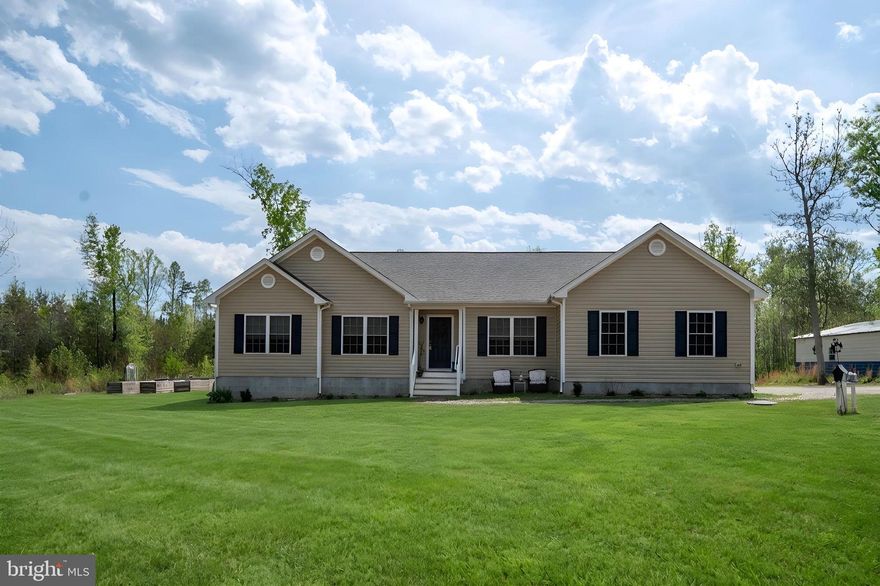 If you have been searching for a property that offers privacy, flexibility, quality construction, and the ability to shape your surroundings to fit your lifestyle, this is an exceptional opportunity. Featuring 5 acres, 564 Equestrian Trail built in 2023 is a place to live expansively, work comfortably, and enjoy the best of country living along with that sought after Lake Anna lifestyle. Tucked privately back from the road and cradled by the unhurried rhythms of Virginia’s lake country this property offers you possibilities that stretch as far as your imagination will allow. So, whether you have been dreaming of a Mini Farm, Garden, Pool or simply a back yard retreat this property, gives you the freedom to choose. Adding to its appeal, the home includes Lake Anna access with a yearly leased boat slip at Pleasants Landing Marina, making days on the water effortlessly attainable. Seller to provide first year’s lease. 
Inside, the home has an open-concept layout along with a split bedroom floor plan offering a bright, welcoming feel. The family room and kitchen area with its cathedral ceiling and beautiful wood beam adds volume to the main living area, while the stone wood-burning fireplace with the raised hearth provides that modern farmhouse charm.  The kitchen serves as the central hub of the home, offering upgraded granite countertops, soft-close cabinetry, extensive counter space, and a generously sized walk-in pantry.  The kitchen is equipped with energy-efficient stainless-steel appliances, including a built-in microwave, electric range, dishwasher, and refrigerator.  Three well-appointed bedrooms are complemented by two flex rooms that expand the home's versatility considerably. One serves as a dedicated soundproofed office or den, is an acoustic engineered retreat, ideal for focused work for home office, Den, Gaming, or simply undisturbed solitude. The second flex room works well for exercise, hobbies, guests, or additional workspace. Along with the two full baths, this is a home designed to adapt gracefully as your needs evolve. The quality of construction shines throughout including upgraded molding, room darkening blinds for comfort and a whole house generator plug already installed. High speed internet through Firefly keeps you seamlessly connected, whether working remotely or streaming your favorite shows. Beyond its inviting interior, the property shines in its outdoor potential. The expansive setting provides a blank canvas for your own private oasis, with room to dream boldly and build intentionally. Raised gardening beds are already in place, offering a head start for gardeners, while the surrounding land invites everything from recreation to cultivation. The Property also delivers exceptional functionality with an attached oversized garage plus a massive 30' x 60' detached garage and workshop — perfect for hobbyists, contractors, or anyone craving serious storage and workspace. 
If you have been searching for a property that offers privacy, quality, and a connection to Lake Anna without sacrificing room to grow, this property stands apart. From the warm architectural character to the flexible floor plan, from the marina boat slip to the workshop and outdoor possibilities, this property is more than a home—it is an opportunity to craft a lifestyle as expensive as the setting itself. If you can dream it, you can create it here, and it is all next to one of the area’s best recreational lakes in Virginia! Opportunity is knocking!

FYI: Pleasant's Landing  Marina is very close by with restaurant , full service boat maintenance and public beach featuring beautiful breath taking mile long views of Lake Anna!