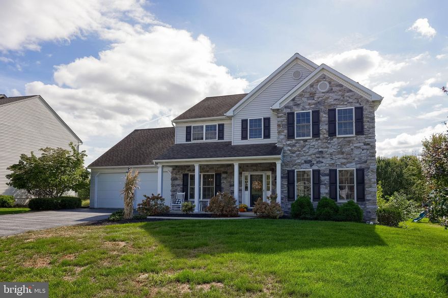 Welcome Home to Julia Lane, one of Manheim Central's most sought-after neighborhoods. Great cul-de-sac location, within walking distance to, downtown, schools, and parks.  This move in ready home has nothing left to do with almost 3,000 square feet of living space on the first and second floor with an additional 1300 square feet in the lower level. The first floor has a bright open floor plan with a large kitchen including an island with seating for eight overlooking the deck and rear yard, making this a great space for everyday living and entertaining, a spacious family room with stone gas fireplace, formal living room, and formal dining room. The second floor has five bedrooms two full baths, and a convenient laundry room. The primary bedroom as two closets and a spa like walk in tile shower. The professionally finished walk-out lower level has a full bath, an additional bedroom or fitness area with large windows, and a large bar area making this great extra living space. Outdoor living includes a deck and large paver patio partially covered under the deck with another paver patio with fire pit, overlooking the generous rear yard. An additional garage area at the basement level is great for a workshop, and extra storage for lawn care equipment. Check out the photos and floor plans and schedule your showing today. Don't miss your opportunity to own this great home in a great location.