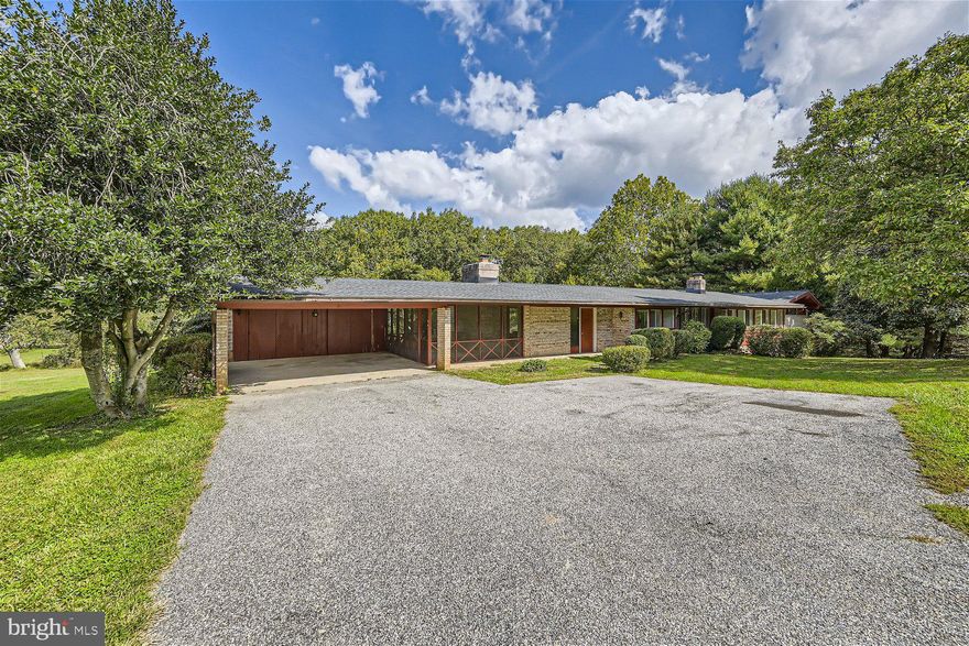 Come see this lovely mid-century modern rancher on 9.63 acres of land right in the heart of Burtonsville! This custom built home is located at the end of a quiet street and is surrounded by County and WSSC land. With lush pasture for horses, cows, or other livestock as well as access to Rocky Gorge Trail, this property is truly one-of-a-kind. The home boasts original slate floors and exposed beams along with many updates. The HVAC, roof, exterior paint, and main level kitchen were all updated recently and a brand new septic system and well pump were installed just this summer. This 5 bedroom, 3.5 bath house has so much optionality. The main level laundry could be converted back to a 6th bedroom and the recently finished basement serves as the perfect in-law suite with its own entrance, kitchen, full bath, laundry, and two bedrooms. There is plenty of room to entertain outdoors with a stone patio, deck, and screened-in porch. For your animals, there is a small barn and run-in shed.  This property offers beautiful views and peaceful quiet located just minutes from shopping and major commuter routes.