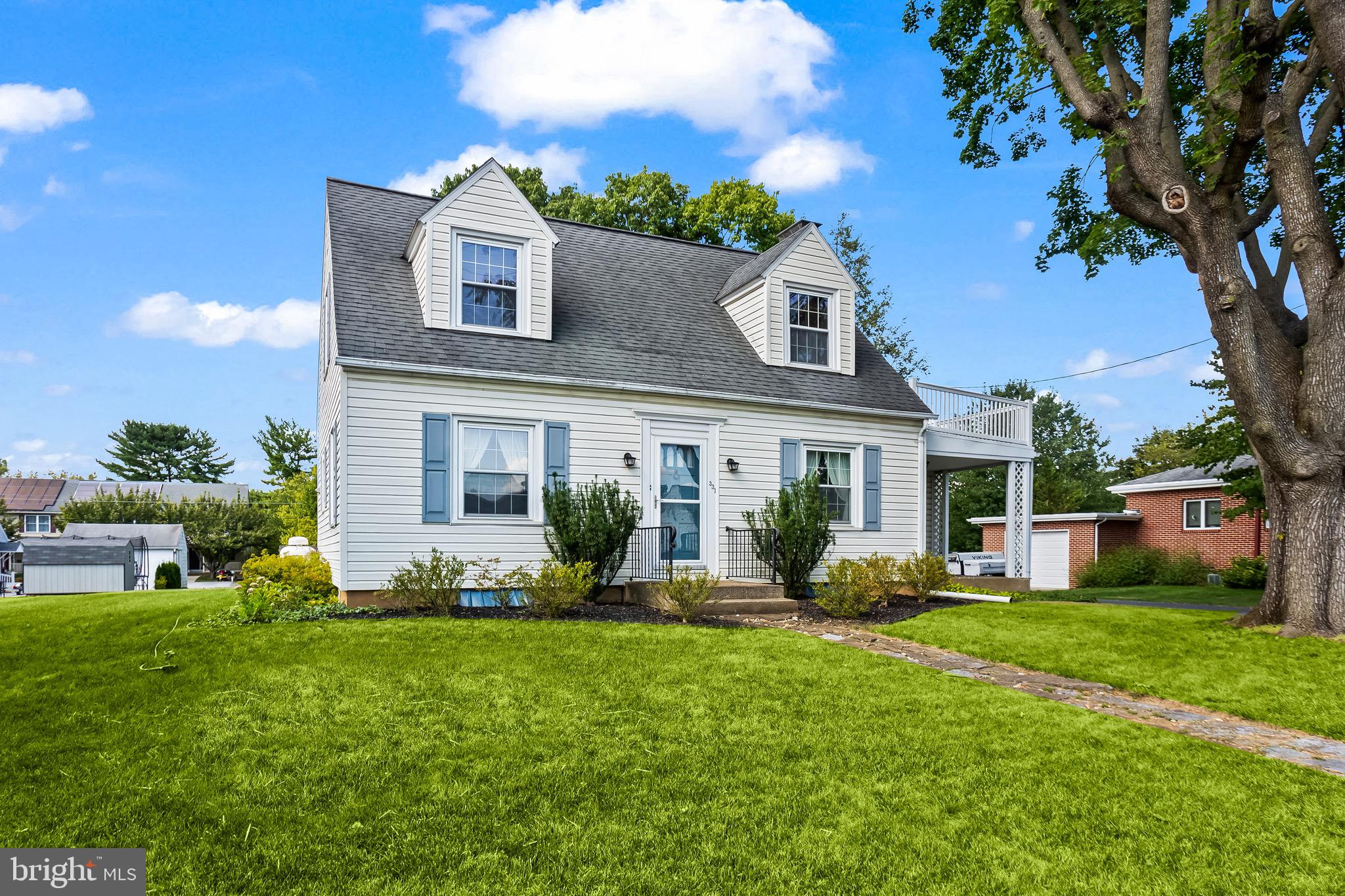 Welcome to 331 W Sheridan – a well-loved Cape Cod in a friendly neighborhood.
Sitting on a flat, open third of an acre , this home offers plenty of space both inside and out. Enjoy morning coffee on the covered front porch, or spend time in the sunroom—converted into a four-season room—that connects directly to the kitchen. The first floor also includes a formal dining room, a spacious living room with wood-burning fireplace, and a full bath. Upstairs you’ll find three bedrooms, another full bath, and an additional room well suited for storage. The basement provides both a finished area and an unfinished section where the laundry is located. There is also interior access to the garage from the basement.