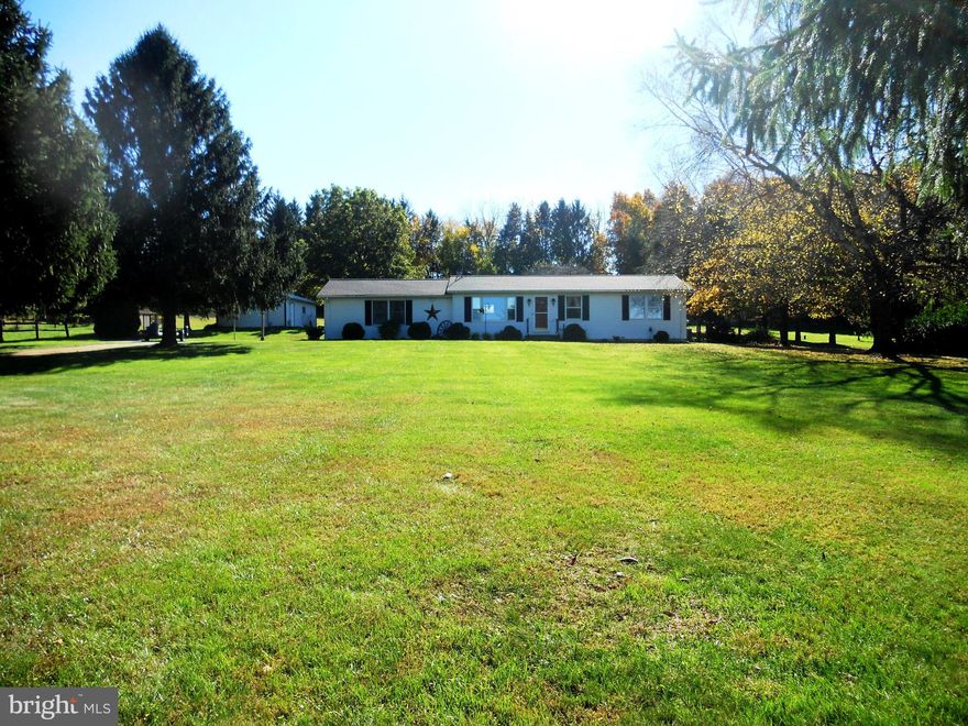 Easy one level living in this well kept Rancher, tucked away on 2.20 acres with a park like setting.  Beautiful countryside lot with plenty of privacy,  open space for gardening, lawn games and wildlife viewing. This nicely maintained home features 3 Bedrooms, dining room, kitchen with custom cabinets, newer stainless steel refrigerator, and ss dishwasher 2021, enclosed porch and unfinished basement just waiting for your personal touch.   Working pellet stove will keep you warm this winter, and help you save money on the utility bills. Take your hobbies to the next level with the spacious workshop in the basement, complete  with workbenches, cabinets, electric and fan.  Relax on the screened porch and enjoy the wildlife and panoramic country view.  Huge pole barn (20'x30'), with electric is the perfect space for car or outdoor enthusiasts.  New roof 2019, oversized 2 car garage, central air and whole house fan. Storage galore with built in cabinets and shelves in the basement and laundry room.   Centrally located between Manchester and Hanover,  PA, with a short drive to Hampstead, Westminster or Codorus State Park.   No HOA. Looking for peaceful, country living? This is the one you've been waiting for.