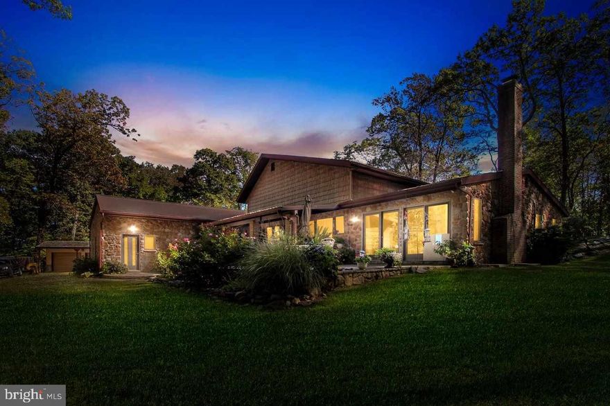 Stunning contemporary home.Almost 3 wooded acres with an amazing view of the valley.Open floor plan.3 fireplaces throughout home.Vaulted ceilings& grand fireplace in main living area.Must see gourmet kitchen to appreciate the workmanship/quality.Family room which is perfect for entertaining then Unwind in the den to take in the tranquility by the fire. Outside is secluded with your own private cabin.The wildlife & nature views are truly peaceful.
