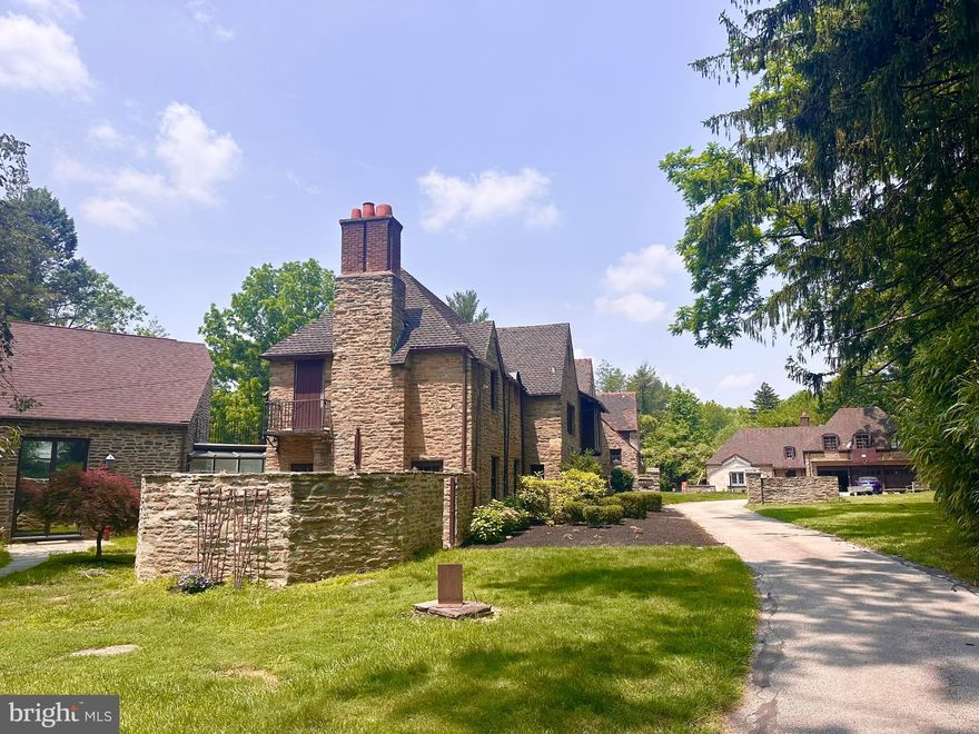 Set on 2.31 acres of private grounds, this 8,300+ sq ft stone estate offers a unique opportunity to own a 
compound-like property  Located in one of the Main Line’s most prestigious neighborhoods, this extra 
ordinary home features three self-contained living spaces, providing unparalleled flexibility. The main residence exudes warmth and elegance, with 8 bedrooms and 4 full baths, making it ideal for a growing household. Classic hardwood floors, multiple fireplaces, and exquisite custom woodwork create an 
inviting atmosphere throughout the home. The chef’s kitchen, with quartz countertops and a spacious prep area, serves as the heart of the home—perfect for both meals and entertaining. The formal dining room, adorned with rich wood paneling, provides an elegant setting for larger gatherings, while the cozy living room with its wood-burning fireplace is perfect for relaxation. The wood-paneled office offers a 
quiet retreat for work or study, and the renovated bathrooms, including two with luxurious steam showers, provide both comfort and convenience. A true highlight of this estate is the expansive gallery space—a versatile space with vaulted ceilings, exposed beams, and a striking stone fireplace. This self-contained area includes its own kitchen, modern bath, laundry, and private entrance, offering limitless possibilities. Whether used as a home theater, playroom, art studio, event venue, or even a dedicated guest suite, this exceptional space can easily be adapted to suit your needs. Above the detached garage, the carriage house apartment provides another private living space with its own kitchen, living room, bedroom, and bathroom—perfect for extended household, guests, or as a rental unit, The estate’s 2.31 acres create the perfect setting for outdoor enjoyment. Relax by the heated saltwater pool, host summer gatherings on the stone terrace, or unwind in the glass-enclosed sunroom overlooking the serene backyard. With dual private entrances from Remington and Morris Roads, the property offers complete privacy, while still providing easy access to surrounding amenities. Ample parking ensures your guests are always accommodated, making this estate ideal for reunions, holidays, or any large gathering. This estate is an extraordinary place to call home.