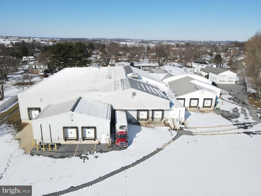 This property will be offered at Public Auction on Tuesday, March 18, 2025 @ 11am.  The listing price is the opening bid only and in no way reflects the final sale price.  $150,000 down due at auction, 2% transfer tax to be paid by the purchaser, real estate taxes prorated. This expansive 38,000 sq. ft. agricultural related processing facility is situated on 6.7 acres, spread across 3 parcels in Lancaster County. The property features a 9,200 sq. ft. warehouse, three residences, a truck shop, truck parking area, and dock space. Formerly the Florin Farms Hatchery, the facility has been exceptionally well-maintained and cared for over the years. Warehouse: 38,062 sq. ft building with combination of office space, warehouse, and workspace. Includes 9,279 sq ft. recently constructed portion of warehouse with 20 ft ceilings, Offers nine dock spaces, Facility includes two separate cold rooms; one can drop to 45 degrees and the other to freezing temperature. Shop: Large truck shop with three garage bays.  Additional amenities: Fenced in truck lot, Facilities feature automatic doors with key cards, 3 income producing residences on the property, three phase electric throughout facility, A 210 amp generator and a 100 amp generator to be sold with property