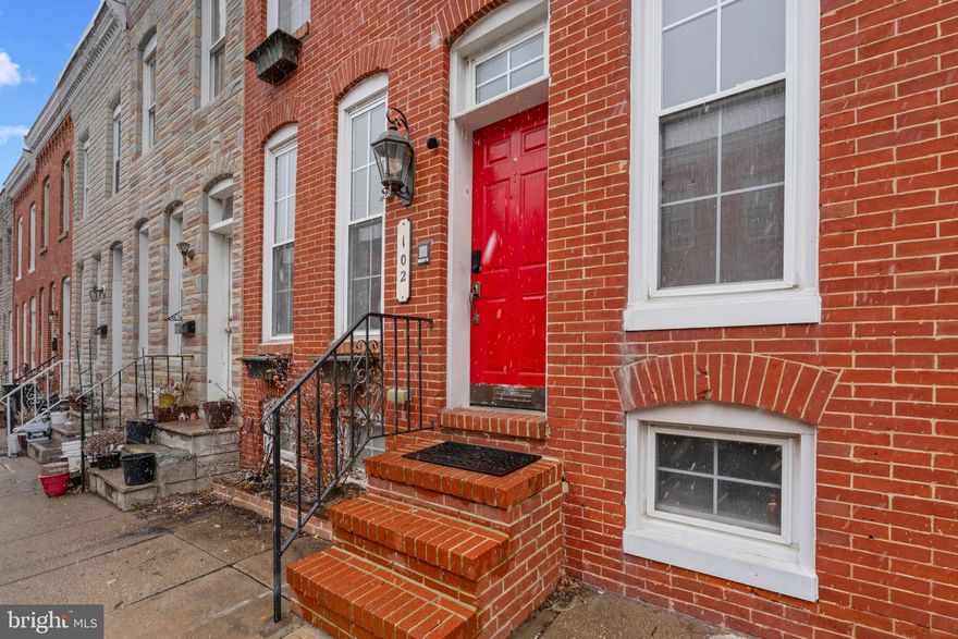Beautiful row home in the heart of Historic Federal Hill!  Enjoy the city skyline on the multi-level rooftop deck.  A must for warm weather entertaining, room for outdoor furnishings and a table. This property features exposed brick accent walls, bead board wainscoting, crown molding, and gorgeous hardwood floors throughout.  The kitchen is equipped with stainless steel appliances, a tray ceiling, 42” cabinetry, a double oven, and granite counters. The primary bedroom suite offers a custom built-in bookcase, a vaulted ceiling, and access to a private rooftop deck with views of the Baltimore skyline.  The fully finished lower level includes ceramic tile, a full bath, and a spacious laundry and storage room, making it ideal for a home office or media center. Additionally, the property includes a fenced patio that can be converted into a parking pad for added convenience. Water heater and microwave replaced in 2025. The home also offers easy access to major commuter routes, including I-83, I-895, I-295, I-395, I-695, and I-95.