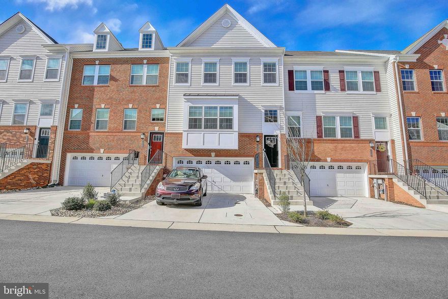 Welcome to pure luxury in the highly sought after Monarch at Waugh Chapel! This lovely, 2019, Townhome boast four levels of living space. The main level of this home is completely open concept. The family room, which feature a beautiful floating fire place, opens up into a gorgeous kitchen. Kitchen upgrades include a 12 foot island, granite counter tops, 42” cabinets, recessed lighting, a butlers pantry, a separate dining area and a walk out to a beautiful deck! Upstairs you will find three bedrooms including a large owner’s suite. The owner’s suite features a custom walk in closet and a beautiful en suite bath complete with granite countertops, tile shower, and a water closet. The show stopper in this home is the 4th floor lounge. The 4th level is a large rec room with cathedral ceilings. This entertaining space walks out to a roof top deck with a perfect wooded view. The lower level is a fully finished family room with a full bath. From the lower level you can walk out to the fenced rear yard. This home is conveniently located near many shops, restaurants, and amenities. An easy commute to the District is an added bonus. Don’t miss this one