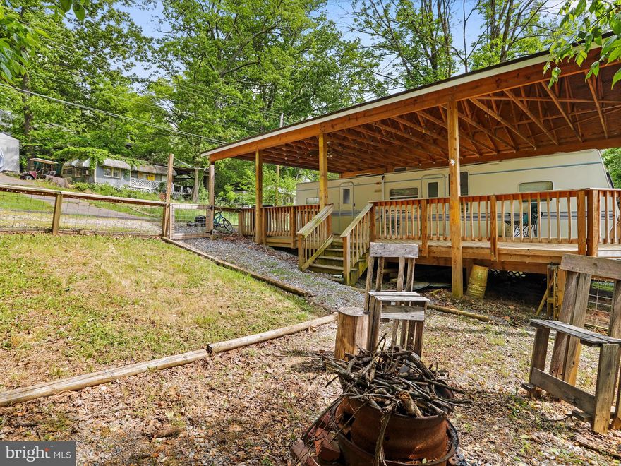 Welcome to your home away from home in Riverbends seasonal campground open April 1 - November 1 each year.  Why rent a vacation spot when you can OWN. Sit on your deck drinking your coffee, beer or both and watch the wildlife walk right up through the woods. 

Block 78 Lot 32 on Forest Ln is ready for its new owner(s) to make it their own and satisfy all their camper needs. This lot has a fenced in yard with a fire pit as well of plenty more land space for whatever your heart desires, and NO direct neighbors on either side.  Want more parking? Space for a shed? expand the fence? Cornhole throwdown pad? There's extra space. 

Large 60 x 90 Lot with Pavillion, Wrap around Deck (5 Years Old) and 1996 (36ft) Camper. Only $35,000 and 2024 dues are paid in FULL. 
 Serious Inquires only. Cash Only. No title. Gas line to camper is not connected. 

12 Miles of deep water on the Potomac River access for boating, fishing & swimming. Yearly membership ($1,775) includes water, sewer, electric, trash and the park amenities such as 3 pools, putt putt, basketball, tennis, horseshoe, fireworks, bonfires, car show, Pool parties, Trick or Treat restaurant, poker runs, bands, playground, ball field and much more. Bring your golf carts, water toys and come enjoy life!