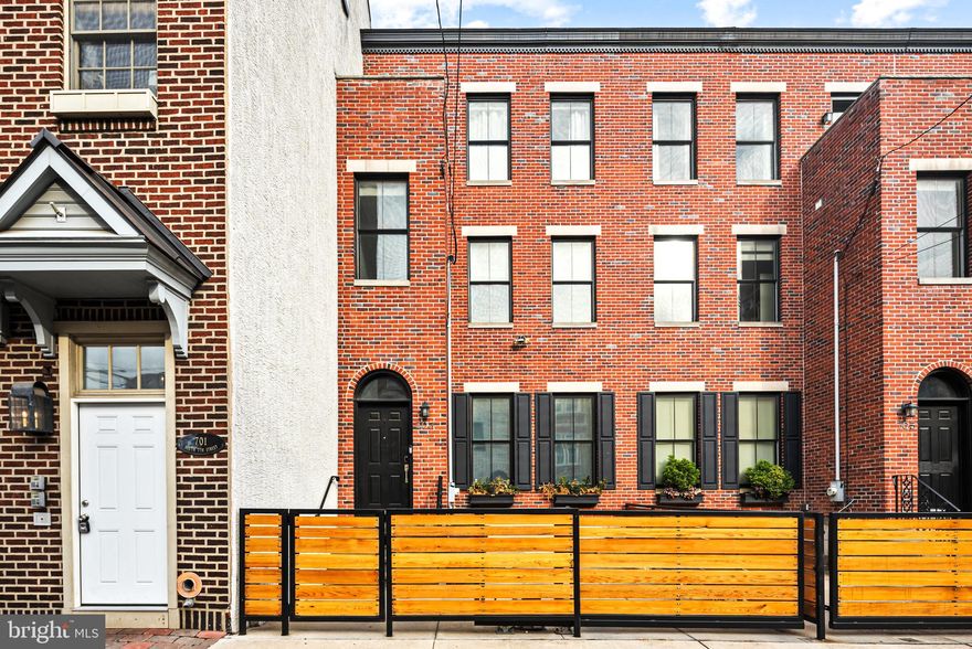 This is the house that you have been waiting for! 703 S 7th St is situated in a prime location and within the Meredith School Catchment. It offers 4 bedrooms,  plus a private office, plus a fully finished basement, 3.5 bathrooms, great back patio plus a roof deck, and 1 car gated PARKING! Everything you need is at your fingertips. Just a few blocks from 2 grocery stores, plenty of parks and playgrounds, and numerous restaurants and cafes, life could not be easier! 
The first floor starts with an impressive vestibule, perfect for keeping the elements out and dropping your shoes and jackets before you enter the house. Open the double doors as you leave the vestibule and feel welcomed into this grand home. Built in 2012, this home oozes character, but offers all of the modern conveniences of newer construction. With floor to ceiling windows at the rear of the home your eyes will immediately wander through the home to the back patio with its beautiful planter boxes. The sleek kitchen has marble countertops with a custom built in kitchen table. A high-end appliance package including an exterior vented hood make cooking in this kitchen a delight. Greenery with built in irrigation and twinkle lights make this patio a wonderful space to relax or fire up the grill (with gas line integrated) and host a summer evening barbecue. 
Make your way up to the second floor which has 3 bedrooms and 2 full bathrooms.  The 2 front bedrooms have custom closets and share a timeless marble bath with a double vanity. The rear bedroom offers an en-suite bathroom with standing shower and two large closets. 
The third-floor primary suite features a walk-in closet, a large bathroom with a double vanity, a soaking tub, and a vast tiled shower. There is also a large closet spanning the length of the bedroom for even more clothes, shoes, and accessories. On the other end of this floor is the bonus room, perfect for a private office, or use it as a 5th bedroom if you don’t work from home. The panoramic roof deck provides 360-degree views of the city with glass railings. Last but not least, don’t forget the fully finished basement with the laundry room for even more space and storage! 
This home is fully automatable and smart enabled, including an active Home Assistant system with hubs for Philips Hue, Lutron Switches and Blinds, plus Fios and hard wired Gigabit Ethernet (CAT-6) available on all floors and an Eero Wifi 6 Mesh network.   Smart devices include Lutron light switches & shades, Nest thermostats, garage gate, fans and more. Compatible with Google Assistant & Apple HomeKit.   
Other upgraded and new appliances include a Rheem on-demand hot water heater, LG smart washer and dryer, and a Bosch combo oven and microwave.  You won’t want to miss this gorgeous home.