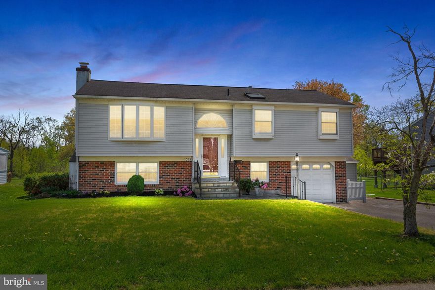 Peaceful Parkside Living in Warminster Township!
Welcome to 1023 Carousel Dr , this beautifully maintained 1,642 sq. ft. bi-level home, perfectly situated on a .28-acre lot backing directly to scenic Kemper Park and the tranquil Neshaminy Creek. Enjoy the ideal blend of comfort, charm, and natural beauty—with walking trails, wildlife, and serene views just steps from your backyard.
The main level features three spacious bedrooms and a generously sized hall bath with double sinks. The kitchen is a true highlight—showcasing vaulted ceilings with skylights, newer stainless steel appliances, and rich cherry cabinetry. It flows seamlessly into the open-concept living and dining area, where Anderson sliding doors lead to a large trex deck—perfect for entertaining or simply relaxing as you take in the peaceful park views.
Admire the homeowner’s fine craftsmanship throughout the home, including custom millwork, elegant crown molding, classic chair rail, and a stunning fireplace—framed with handpicked stone and a slate hearth sourced directly from Independence Hall, adding warmth and historic character to the space.
Downstairs, the lower level offers incredible versatility, with a large family room featuring a cozy propane fireplace, built-in shelving, and a wet bar—ideal for gatherings. You’ll also find the fourth bedroom, a full bath with a jetted tub, and a separate laundry room complete with a utility sink and indoor clothesline. The heated one-car garage offers convenient interior access.
Year-round relaxation awaits in the bright, three-season sunroom, surrounded by windows and natural light—perfect for morning coffee, quiet reading, or a casual breakfast.
The backyard is thoughtfully designed with a beautiful Pennsylvania bluestone patio, a large work shed, and additional storage to accommodate all your gardening and landscaping needs.
This one-of-a-kind property is a rare opportunity to enjoy nature, space, and even a touch of history—all in one place. Don’t miss your chance to make it yours!