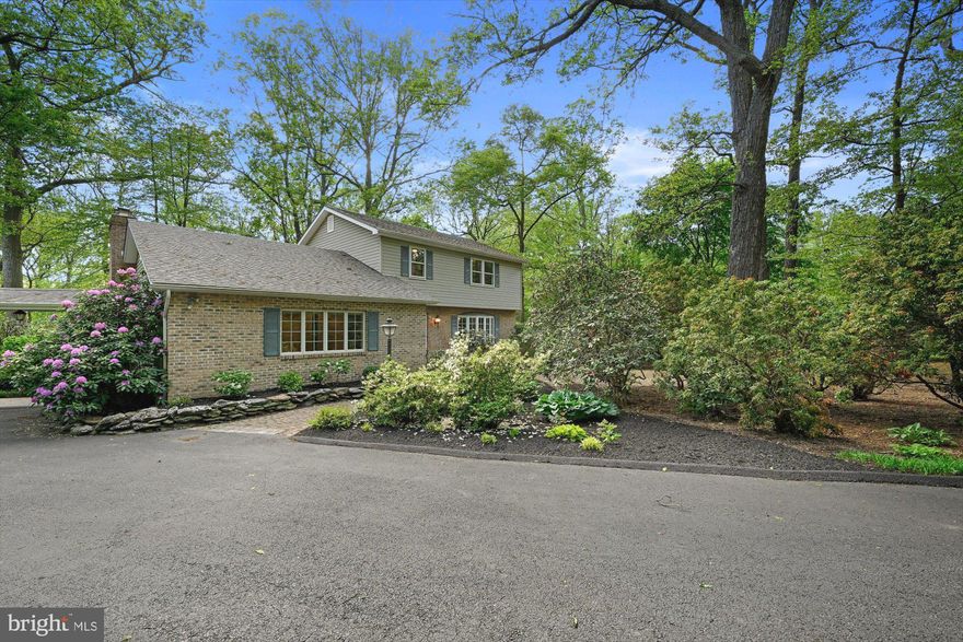 Peaceful pleasure awaits you when you visit this lovely, manicured Colonial sited perfectly on a  2.68 acre wooded setting (comfortably set off of Middletown Road!)!  As you  drive in, and arrive on the parking area,  observe the specially selected plantings sited on the lot - selected based on shade or sunlight as needed, and aimed to allow  the owner to enjoy easy care of his beaautiful setting!  Recent years have seen a huge list of upgrades and expansions to this property - to include, but not be limited to:  siding; roof; opening the kitchen - dining room so as to allow the new kitchen to be installed  (cherry cabinetry, granite counters, etc) and the enjoyment of the large picture window in the adjacent dining area; additional expansion that afforded the owner a large den/office with custom built-ins (SEE NOTE below regarding this room.); American cherry wood flooring in the kitchen, breakfast area, and the living rm (used by the owner as a formal dining rm).  Main level also features a spacious Family Rm with a wood stove - accessible to the deck and screened porch. On the upper level, the original primary bedroom and the hall had California custom designed closets installed with glass custom doors, as well as a new primary bath.  NOTE:  With reasonable adjustments, the 'current use' main level Office/Den can easily be transformed to a Main Level Primary Bedroom - reverse a closet, remove desk built-in, expand bath by adding a shower and install closet!  You will be duly impressed by the addition of a 4-car garage - of course, totally matching the exterior finishes of the home.  Above the garage, withs its own PRIVATE ENTRANCE is a full apartment - open design for kitchen, dining, and living room, a full bath and a spacious bedroom (where a sliding door has been installed, and a deck band board installed in case the next owner wants to install a balcony/deck off the bedroom - overlooking the wooded setting!).  The storage space in this apartment is amazing! A covered breezeway connects this garage/apartment to the main house.
Be certain to check out the double-sized storage shed (again its finishes match the house exterior) with power supplied - sited at the end of the driveway.  Going back to the main house:  There is a full basement, finished, and it has access to the yard.  Numerous storage areas & built-ins are provided in this area.  Off the kitchen-dining area - you will enjoy the WOW factor of the  fantastic screened porch with its vaulted ceiling .  It opens to an expansive Azak maintenance free deck surrounded by custom designed aluminum railings.  Sitting out here will allow all to enjoy beautiful sunsets and the privacy that this lot provides every day!