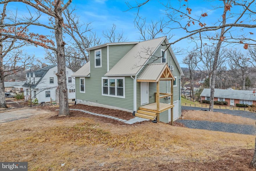 New-quality home construction.  Within walking distance to downtown Berkeley Springs.  3 bedrooms and 2 full baths.  Main level living includes laundry, master bedroom and master bedroom.  Lots of natural light and LVP flooring on the main level.  The beautiful kitchen island is the main focal point of the first level. Upstairs includes 2 bedrooms and a full bath and a flexible space in between for use as an office or reading nook. Basement level offers space to put in an apartment and offers a front entry garage.  More nice features are a metal roof and ductless heat pumps and air conditioning that are very energy efficient.  A true must see!