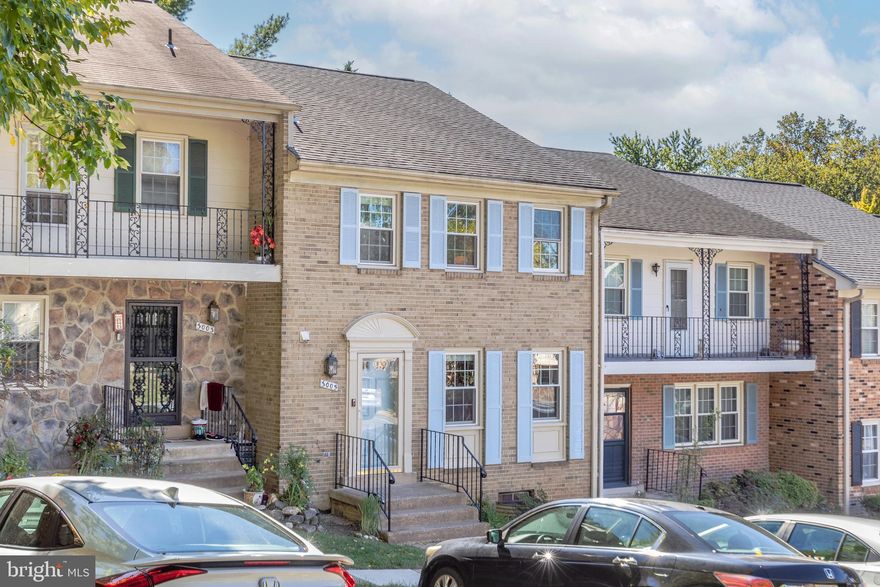 Set in the well-kept Seven Oaks community less than a mile from East Falls Church Metro, this classic brick townhouse checks all the right boxes. The main level gets beautiful natural light throughout, with spacious living and dining areas and an updated kitchen featuring stainless appliances, ample counter space, and a charming bay-window breakfast nook. Upstairs, the spacious primary suite includes a walk-in closet and private bath, joined by two comfortable bedrooms and a hall bath. The lower level adds versatility with a wood-burning fireplace,  wet bar with wine fridge, and a spacious bedroom and full bath that make an ideal guest suite. A walkout leads to a large fenced patio, perfect for relaxing or entertaining. Thoughtful updates include Ring doorbell and Nest thermostat (2020), washer/dryer (2021), dishwasher and refrigerator (2024), and water heater (2025). Two assigned off-street parking spaces complete this move-in-ready home close to Eden Center, shops, parks, and commuter routes.