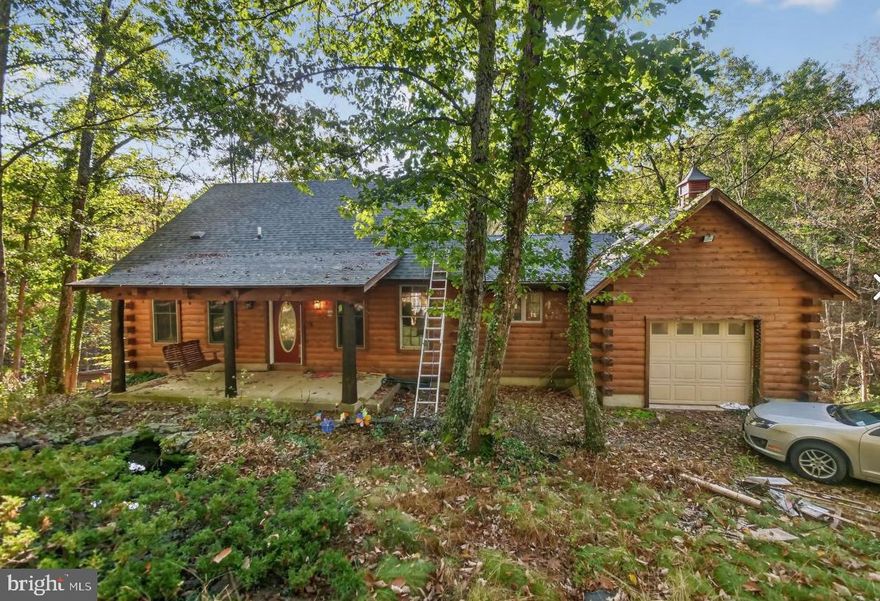 Log home in a peaceful and quiet setting.  Unrestricted land.  Many possibilities on this property.  Spacious interior with lots of natural light and warm wood accents.  Enjoy the view off the back deck of the woods.  New roof was put on this summer. Close to plenty of recreational areas as well in the area.  Basement is finished as well for additional living space.  A small spring fed pond is also on the property.  Book your appointment today!