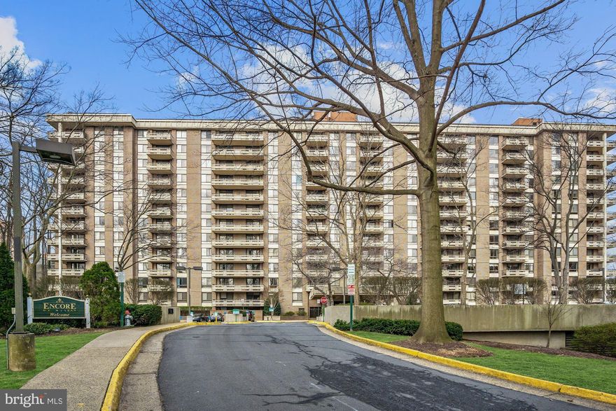 10K major price reduction! Wow Stunning Just Renovated Open Kitchen With Extra Wide Breakfast Bar, Recessed Lighting, Quartz Countertops and SS Appliances. Location! The Encore is ideally located in the heart of Tysons Corner. Walkable to the McLean Metro, and  Wegmans. Great shopping and fine dining is right around the corner at Tysons Galleria and Tysons Corner. The Encore features great amenities that you will come to enjoy. Gated entrance, secured building entrance, 24/7 Concierge, Library, Party Room, Gym, three pools, Property Manager on site. A short underground walk to Dry Cleaners, Hair Salon and Convenience Store. Freshly painted unit is move in condition. Wood floors in living room and bedroom, marble foyer. Living room opens to a nice balcony. Extra storage and assigned parking space #78.