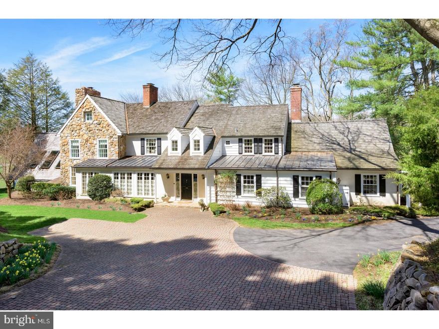 Set on a gentle rise with views of the property's 6 acres, wildflower meadows and  winding stream, find this exceptionally finished 5 Bedroom, 5/1 Bath home in the heart of Easttown, Chester County. Exquisite appointments on the homes four finished floors include on the ground level a stunning Spa/Wellness Center, Caterer's Kitchen, Gym, Sauna, Indoor Pool and retreat quality raised Hot Tub.  A wide stone Veranda provides the ideal western view for enjoying breathtaking sunsets while watching play on the adjacent Tennis Court.  This welcoming Chester County facade opens to reveal a home professionally and richly detailed. The transverse Foyer leads to a handsome step down Living Room highlighted by inlaid floors and a marble surround fireplace. The formal Dining Room, generously sized for large gatherings,showcases extraordinary millwork with custom Chippendale styled built-ins fitted with seeded glass, flanking a wood fireplace. Meaningful for both storage and flat service area the Butlers Pantry connects the Kitchen to the Dining room. Designed to enjoy the expansive views of the property, the Chefs Kitchen offers all requisite high-end quality appliances while a sliding French door reveals a beautifully  and privately landscaped terrace overlooking the front of the property as well as longer views of the neighboring homes and farms. The Breakfast  Room is brightened by  a series of skylights and floor to ceiling windows while the adjacent Family Room is warmed by rustic wood floors, hand hewed paneling and a brick surround wood burning fireplace. Ideally located for privacy off the formal living areas find a fully custom Library:Home office.  Designed for book, file and concealed  equipment storage the space has a private stair leading to the Master Bedroom. A turned front wrought iron stair leads to an exceptional Master Suite featuring a separate Sitting Room with views of the front arrival courtyard. His and her custom Closets and a shared marble volume ceilinged Bath offer indulgent Master retreat space.  Two additional bedrooms/bedroom suites, one with ensuite the other with a hall bath, are found on this level. The third floor offers a two room suite, full bath and ample storage.  Out buildings including a staff apartment over top the detached garage add both utility and interest to the property.  Superior home with the heart of a country house, the amenities of a five star spa.