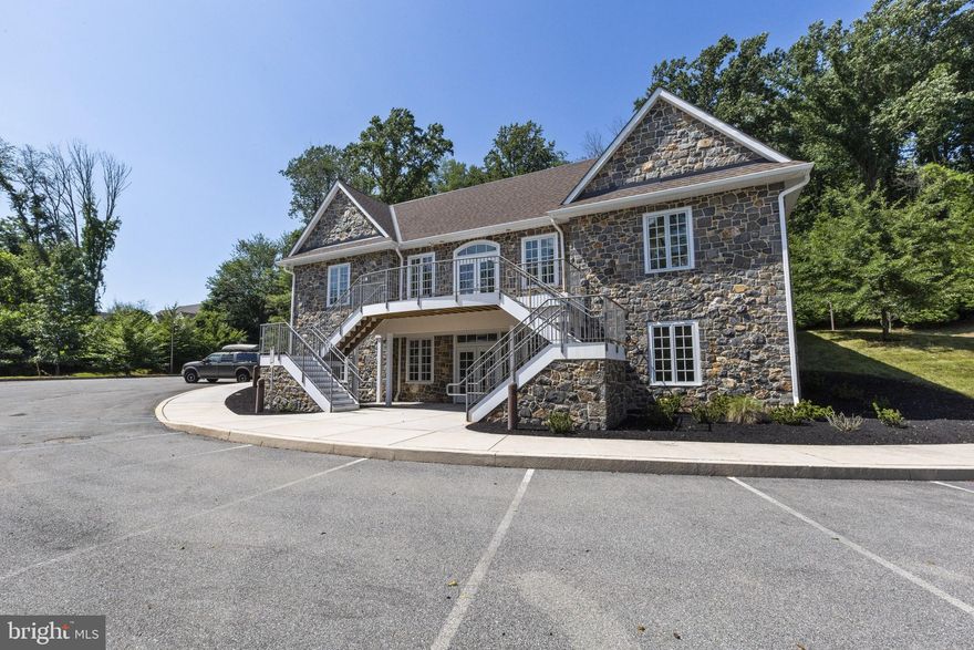 Possible Owner Financing Available...PRIME BUSINESS LOCATION!! Unique Gorgeous Stone Cutting-Edge Professional Office Campus! Perfectly situated just off route 1 in Historic Chadds Ford, high above Baltimore Pike with breathtaking views of the Brandywine Valley. A private drive escorts you away from southbound route 1. The two front & rear light-filled lobbies promote gleaming hardwood floors, fieldstone and glass, and white-wood doors. The main floor separate office space features five modern offices, surrounding an impressive glass-walled dome ceiling conference room, a copy center, break/lounge room, a media room and two ADA-compliant bathrooms. On the separate office space on the lower level are four additional office spaces also featuring two ADA-compliant bathrooms, galley kitchen, geothermal mechanical room, two storage rooms and a third space designed to be a locker room. Currently set up as two separate office spaces for two separate companies.  Could be changed back for one company to occupy the entire building. Four acres of manicured ground surround this exquisite office building, along with an array of parking. Don’t miss the chance to own this amazing premium Chadds Ford location.