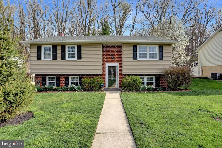 Looking for a home with an In-Law Suite?...THIS IS IT!! Located in the popular Springdale Community  this Fabulous Split-foyer home has many amenities to appreciate and enjoy.  Main level has 3 bedrooms, Updated tiled bathroom with heat lamp, hardwood floors under carpeting, Fantastic kitchen with lots of cabinets, Stainless appliances, upgraded countertop , tile backsplash,  recessed lighting, with sliders leading to spacious trex deck.  Lower Level In-law suite features family room, fully equipped eat-in kitchen, laundry area, family room, 2 bedrooms & a full bathroom. The spacious fenced in yard features Amish built shed and backs up to Loch Raven Watershed. Extras include (but not limited to) House Generator for peace of mind, Thomas creek gutters,  Attic fan & insulation thermostat (2014), Roof & siding -2015,  Tankless hot water heater, dishwasher -2019.  Needs some cosmetic improvements ie. painting & carpet replacement. Springdale pool and tennis club is walking distance-Membership required! Close to schools, shopping, trails, great restaurants, major highways, and more. Being sold "As Is".  Let me be the first to say "Welcome Home"