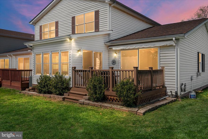 Welcome to this gorgeous end unit townhouse offering low-maintenance living in a highly convenient Kent Island location. Thoughtfully designed with both comfort and flexibility in mind, this home features 2 spacious bedrooms and 2 full bathrooms, along with a versatile converted garage space that can easily function as a 3rd bedroom, home office, den or be returned to a traditional garage. The long, well-appointed kitchen flows seamlessly into an open concept living area, creating a bright and connected space perfect for both everyday living and entertaining. Just beyond, a bonus sunroom adds additional living space filled with natural light, making it the perfect spot to relax year-round. Step outside to the large rear deck, where you’ll enjoy added privacy and peaceful views of the pond and fountain — an ideal setting to unwind at the end of the day or host guests. With its end unit positioning, flexible layout, and serene outdoor setting, this home offers the perfect blend of convenience, comfort, and easy living.