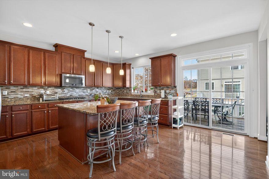 ***Offer Deadline Monday 03/09/2026 @ 6pm*** Welcome to this beautifully maintained end-unit townhome in the peaceful and impeccably kept Powells Landing community, seamlessly connected to Eagles Point and Port Potomac. This gorgeous home has been meticulously cared for from top to bottom and is truly move-in ready. Flooded with natural light thanks to its premium end-unit location, it offers space, style, and comfort that will exceed any buyer’s expectations. The main level features pristine hardwood floors and upgraded recessed lighting, creating a warm and elegant atmosphere throughout. At the heart of the home is an entertainer’s dream gourmet kitchen, complete with a massive center island with pendant lighting, double ovens, granite countertops, decorative backsplash, stainless steel appliances, and an abundance of cabinetry. Whether hosting intimate dinners or larger gatherings, the spacious deck just off the kitchen provides the perfect setting for outdoor entertaining. Upstairs, the owner’s suite is a true retreat, boasting custom his-and-her walk-in closets and generous living space. The fully finished walk-out basement offers additional flexible living space with ample, thoughtfully designed lighting—ideal for a recreation room, home office, or guest area. Whether you're a small family looking for extra space or a growing household needing room to expand, this home effortlessly adapts to meet your needs. Additional highlights include Spacious two-car garage, Large gourmet kitchen with abundant storage, beautiful end-unit location with added privacy, Meticulous maintenance throughout. Enjoy a fantastic commuter-friendly location just minutes from Interstate 95 and U.S. Route 1—making your daily commute smooth and stress-free. Conveniently close to Potomac Town Center, Potomac Mills, and The Rose Gaming Resort, and surrounded by abundant shopping, dining, and entertainment options.
This stunning townhome truly checks every box—comfort, elegance, prime location, and commuter convenience.