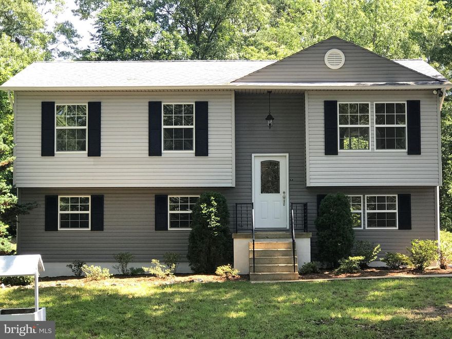 Completely renovated Split Foyer on 1 acre!  House has been completely renovated inside and out, new roof, siding, deck, heat pump, appliances, cabinets, bathrooms, lights, everything!  It's a new house! This is a must see and a great opportunity to own a brand new property at a fabulous price.  It's a charming clean slate in a great location and ready for a new owner.