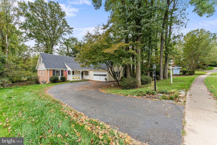 Welcome to this lovely 5 bedroom, 4 bath home in the highly coveted Camelot neighborhood. The Camelot neighborhood has no HOA and features a community pool you can join for a fee. There is an in-community elementary school just a few blocks away, adding an extra layer of convenience.  The house has a formal living room, a banquet-sized dining room with wood-burning fireplace, a sunny kitchen with plenty of room for a table and a bump-out sitting room with cathedral ceiling and large windows. There is an expansive deck and fenced-in backyard. The Owner’s Suite is located on the main level along with the second bedroom with another full bath. On the second floor there are two more spacious bedrooms and a full bath. The walk-up basement has a large theatre room, perfect for family movie nights and entertaining friends. There's also plenty of space for an indoor gym. The 5th bedroom is downstairs with a large window and a large full bath. The laundry room and extra storage space are also on this level. Conveniently located minutes away: Inova Fairfax Hospital, Mosaic District, Tysons, Vienna and Fairfax City making shopping,  dining and entertainment options abundant. The Dunn Loring Metro, I-66, route 50, I-495, and I-395 are also just minutes away.  Express bus to the Pentagon is located at front of the neighborhood. Don't miss the chance to make this Camelot residence your own. Schedule a showing today and experience this remarkable home. Welcome home!