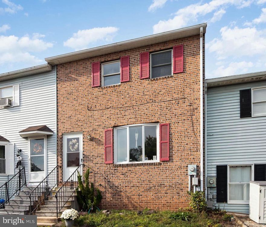 This townhome features 2 bedrooms, 1.5 bath, 2 stories with partial walk-out lower level and is ready for your personal touches to call it home! Main floor features Living Room, Dining Room and Kitchen. Hardwood floors throughout first floor. Second floor features 2 bedrooms and a full bathroom.  Basement is walk-out with ample storage and laundry area.