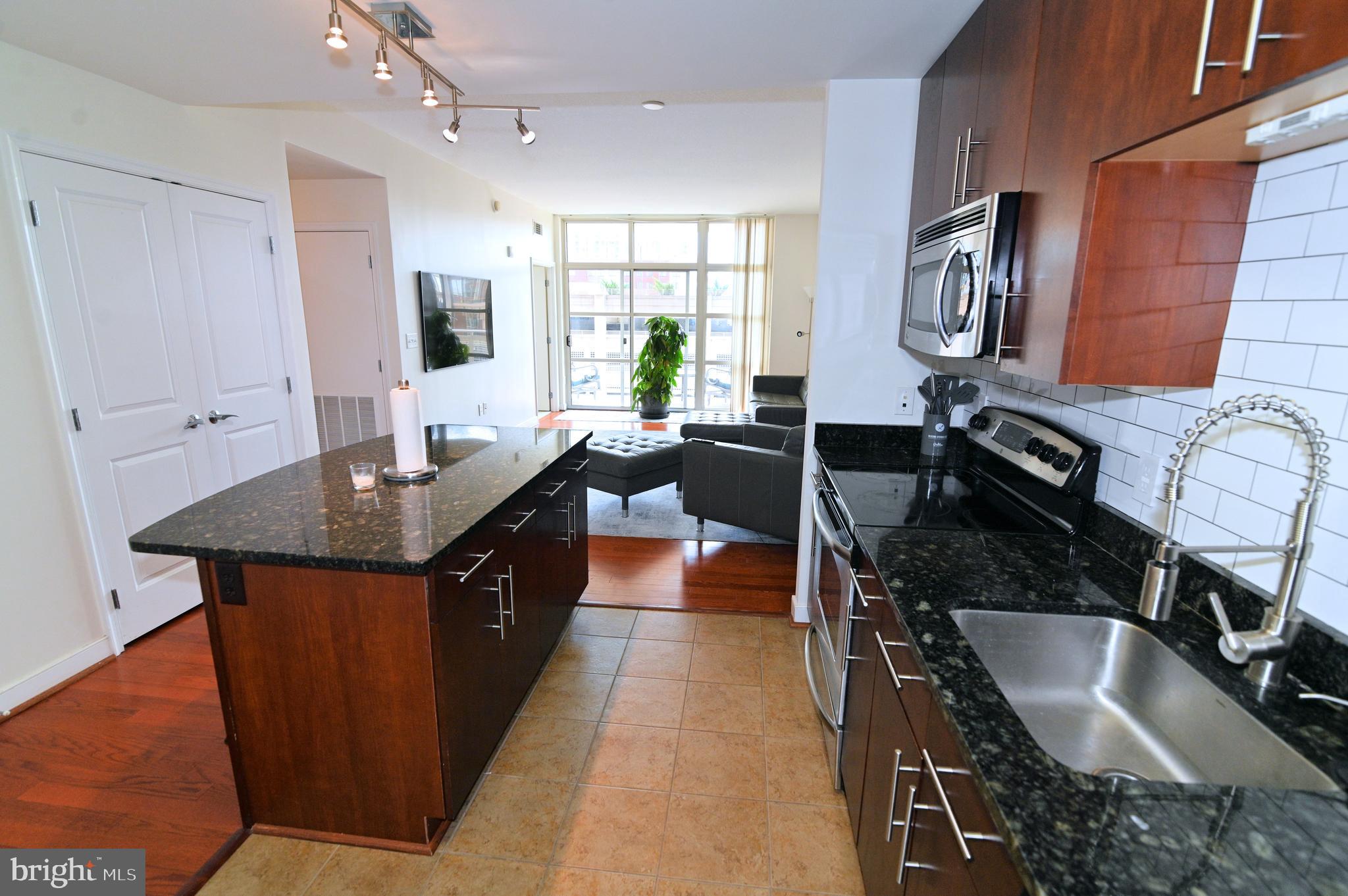 ***PRICE REDUCED*** Luxurious Living in the Heart of National Harbor - Discover 2 bedroom urban elegance in this fabulous condo nestled in the vibrant Harbor neighborhood of National Harbor, MD!! From the moment you step inside, you’ll be captivated by the beautifully updated kitchen featuring a sleek island—perfect for entertaining and culinary creations. The open floor plan is accentuated by gleaming hardwood floors that lead you to spacious living areas flooded with natural light. Enjoy breathtaking panoramic views from the expansive deck 5 stories high, an ideal setting for relaxing or hosting gatherings while overlooking the scenic Potomac River, with captivating vistas of Washington DC and Virginia. The condo offers a spacious walk-in closet for all your storage needs, and the convenience of an in-unit washer and dryer. Situated just steps from a variety of major restaurants, shopping, and entertainment options, this home puts you at the center of lively activity. Walk to the Gaylord Convention Center and MGM Casino, or indulge in retail therapy at Tanger Outlets—all within a short stroll. This luxurious residence combines modern conveniences with a vibrant, walkable lifestyle in one of the most sought-after locations in the DC metropolitan area. Experience the perfect blend of comfort, style, and convenience—welcome to your new home at National Harbor!