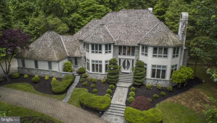 With everyone hunkering down these days, 46 Sleepy Hollow is  the perfect place to work and play from home. This stately, custom built 5 bedroom, 6.5 bath colonial with a contemporary flair is on one of the best lots in the desirable community of "Springton Pointe." This is a great house for multi-generational, in-laws, au-pair or entertaining overnight guests with a separate living suite and full kitchen on the lower level! Enter the dramatic 2-story foyer with gorgeous inlaid Carrera marble flooring and sweeping curved staircase. To the right is a formal living room with new hardwood floors, a marble fireplace and wet bar, perfect for entertaining. You won't mind working from home in the handsome office/study with built-in desk and bookcases and a coffered ceiling. To the left of the foyer is the formal dining room with crown mouldings and large bay window, offering a gorgeous view. The eat-in kitchen, with radiant heat floors, has a large island with granite countertops, new Wolf & Kitchen Aid appliances, built-in new Sub Zero refrigerator, and is open to the family room and breakfast room. The huge windows  in the breakfast room afford an amazing view of the pool and expansive yard. The large family room with vaulted ceiling and marble fireplace is the perfect spot for family gatherings or watching a movie w/the built-in speakers & surround sound. Off the kitchen is a play room or a second office with built-in bookcases. Main floor laundry (with a laundry chute from the second floor) and two half baths complete this floor. The second floor features four bedrooms and three full baths and the third floor has it's own princess/teen suite. The spacious master bedroom boasts it's own marble fireplace and a cathedral ceiling. His and hers walk in closets w/built-in closet systems and a private balcony. The luxurious marble master bathroom includes a jetted tub, large shower, double sinks with make up vanity with radiant heated floors. Two bedrooms share a jack-n-jill full bath with double sinks and one en-suite bedroom with it's own full bath. The third level is perfect for an au pair or teen wanting privacy in their own suite with beautiful marble bathroom w/jetted tub. The huge lower level with 9' ceilings features a new full kitchen with wood cabinets and granite countertops, pool table area, gym, TV hang out area with stone fireplace, a full bath and another room with a closet.  A total of over 2600 of living space on lower level. The back yard is an oasis with mature plantings, pool and hot tub. With over 9,000 square feet of living space, this is a great value! A short ride to the Amtrak train station in Paoli with trains to NYC. Conveniently located near Newtown Square shopping, restaurants & Whole Foods. 20 min. to airport, 30 to Phila & 35 min. to Wilmington. NEW TAX ASSESSMENT FOR 2021 IS $807,470. TAXES WILL BE REDUCED CONSIDERABLY