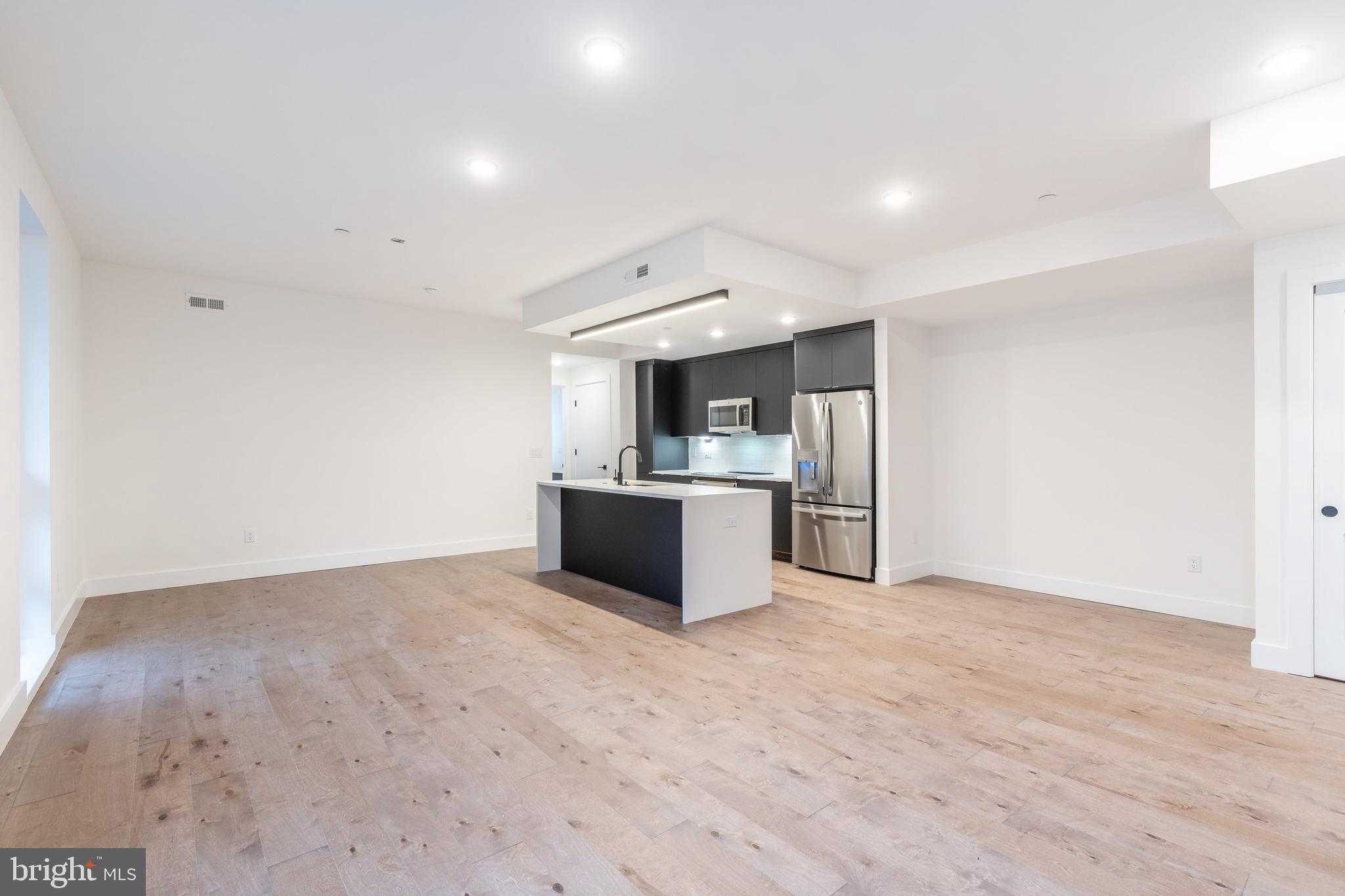 This property qualifies for a 1% INTEREST RATE BUY DOWN for the 1st year at ZERO cost when using the preferred lender! Welcome to Otto on the Park, a sophisticated collection of contemporary condos offering the convenience of parking and more. Enjoy a tax abatement through 2032! Amidst a burgeoning neighborhood, this unit boasts a private balcony and a shared roof deck with breathtaking skyline views. The open floor plan features hardwood floors, soaring ceilings, and abundant natural light throughout. The spacious living area includes large windows, recessed lighting, and ample space for an entertainment setup. A dining area with balcony access compliments the chef-style kitchen equipped with white cabinetry, a generously sized island with breakfast bar, subway tile backsplash, and stainless steel appliances. The unit offers three well-appointed bedrooms with ample closet space. Both graciously sized bathrooms are elegantly designed with beautiful finishes. Additional highlights include in-unit laundry facilities and convenient storage space. Residents can enjoy a communal roof deck featuring a kitchenette, grill, skyline panoramas, dog run, and room for gatherings. Nearby amenities include Revival Brothers Coffee across the street, as well as proximity to Fairmount attractions such as the Schuylkill River Trail, Boathouse Row, and the Philadelphia Zoo. Taxes & square footage are the buyer's responsibility to verify independently. Photos are for marketing purposes only and may not portray actual finishes/be from another unit. Inquire with the listing team for more details. The PAR Standard Agreement of Sale for New Construction must be used for new construction properties, whether completed or not.