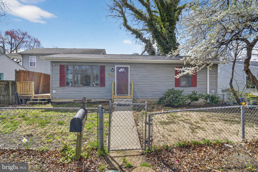 3-bedroom, 3-bath home with a renovated interior and hardwood flooring throughout. Functional layout with updated finishes, including stainless steel appliances. Includes a sunroom addition that provides additional living space, along with a fenced-in yard offering privacy and usability. Solid overall layout with good interior and exterior features.