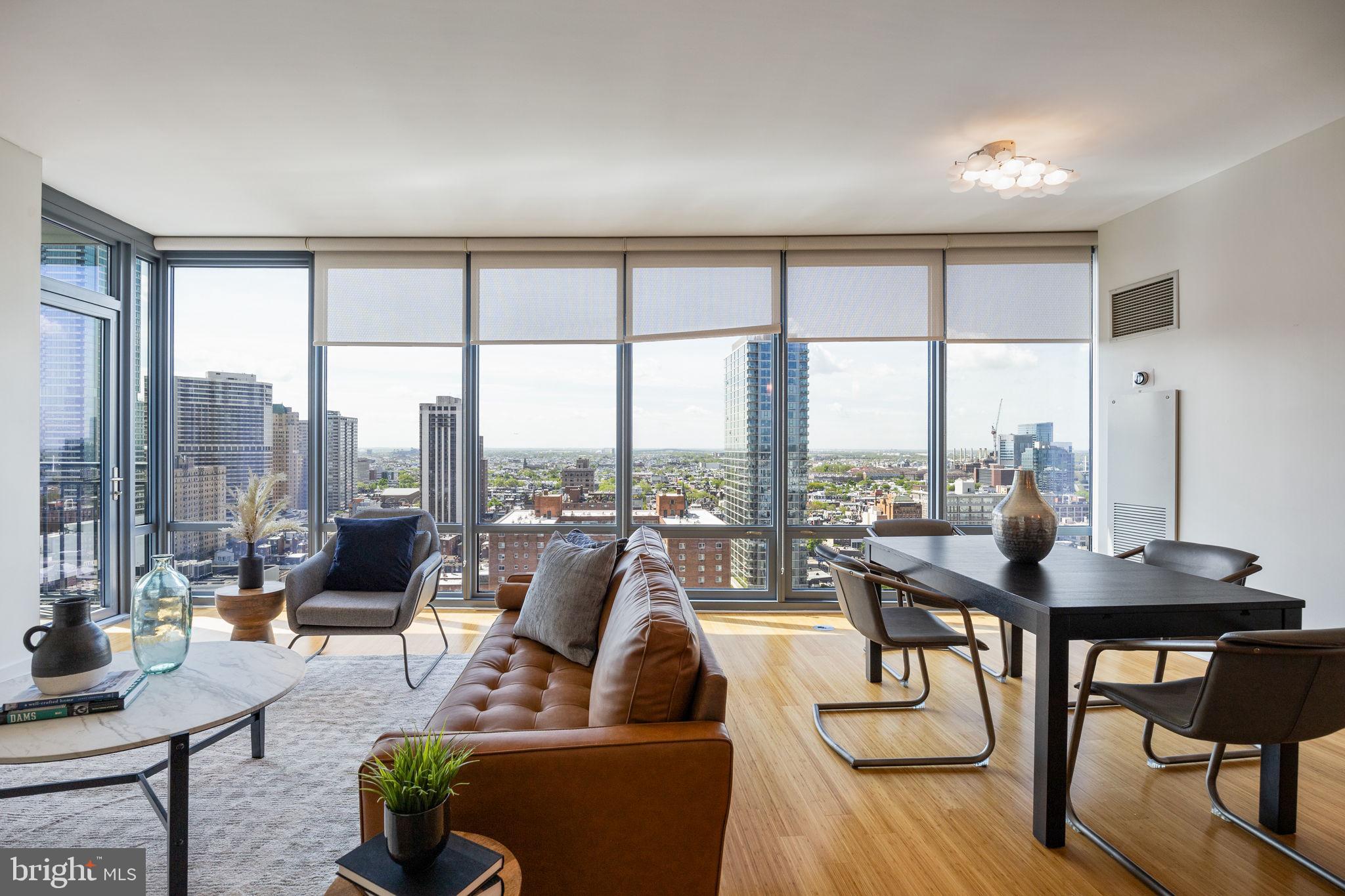 Welcome to Unit 2204 at the Murano – a rare south-facing gem in the heart of Center City! This spacious and light-filled 1-bedroom, 1-bath residence boasts 943 square feet of open-concept living with floor-to-ceiling windows showcasing stunning skyline and river views. The southern exposure floods the unit with natural light throughout the day, creating a warm and inviting atmosphere. Step inside to discover an incredible amount of closet space—a truly rare feature for city living. The sleek, modern kitchen is outfitted with granite countertops, stainless steel appliances, and a breakfast bar perfect for entertaining. The generously sized bedroom includes a walk-in closet and room for a workspace or seating area. The spa-like bathroom features a glass-enclosed shower and soaking tub for ultimate relaxation. Enjoy full access to the Murano’s luxury amenities, including a 24-hour concierge, indoor heated lap pool, fitness center, sundeck, and hospitality suite. One-car garage parking and private storage are included with the unit. Conveniently located just steps from Rittenhouse Square, 30th Street Station, Trader Joe’s, and the Schuylkill River Trail, this rarely available unit offers the perfect blend of comfort, style, and convenience. Don’t miss your opportunity to own a standout home in one of Philadelphia’s premier residential buildings!