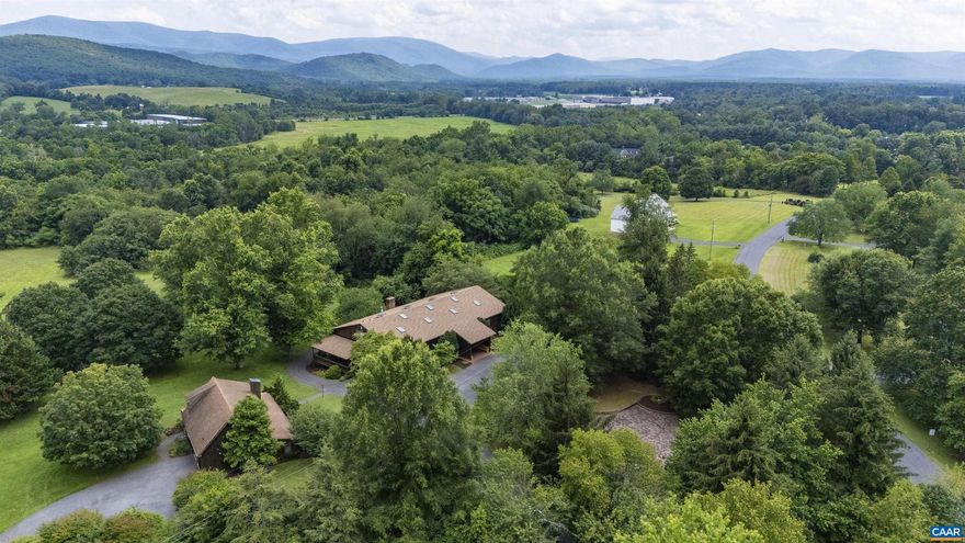 Embrace a rare opportunity to own a truly distinctive RIVERFRONT ESTATE rich in character and possibility. Set on two serene, manicured lots totaling nearly 14 ACRES resting along the banks of the SOUTH RIVER, this remarkable property offers privacy, and endless potential.   The offering includes a 3-bedroom residence thoughtfully positioned alongside an impressive 5,000 sq/ft multi-use live/work structure. Originally a fully operational apple barn, this impressive dwelling showcases soaring ceilings, dual lofts easily adaptable to private spaces. A full kitchen, formal dining space, three full bathrooms, and an unfinished walk-out basement make it ready for customization.  With its unique blend of historic charm and flexible space, this property is ideal for creatives, entrepreneurs, multi-generational living, or anyone seeking an inspiring setting with room to grow. Previously home to the renowned American artist P. Buckley Moss, the estate carries a meaningful legacy while offering the perfect canvas for its next chapter.   Listing includes a vacant, buildable lot of 5.072, and 363 feet of RIVER FRONTAGE along the South River.,Solid Surface Counter,Wood Cabinets,Fireplace in Rec Room