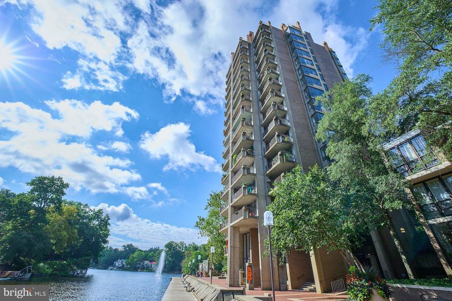 Welcome home to the perfect pied a terre in Reston's iconic Heron House. Built in 1965 by founder and developer Robert E Simon this is Reston and lakefront living at its best.  Ideal for a live/work/play residence or for someone who commutes weekly from out of state and wants a charming, secure place to stay when in town.  Hardwood floors though out, nice kitchen and bath.  Large balcony and stunning views of Lake Anne, the plaza and fountain.  Walk to shops, restaurants and easy walk to Reston Town Center and the metro.  Lake Anne Plaza is home to one of the top farmers markets in all of the DC metro area - Saturdays on the plaza.  Note:  the condo fee includes all utilities!