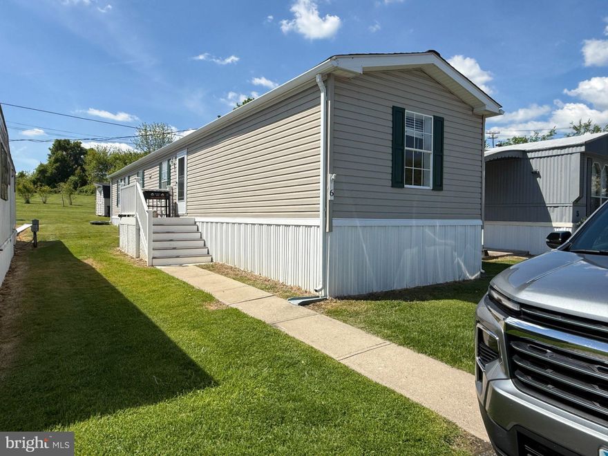 Discover a charming residence nestled within the serene Wrights Manufactured Community, where comfort meets modern living. This meticulously maintained 1973 manufactured home boasts an inviting atmosphere, perfect for those seeking a blend of style and functionality. Step inside to find a spacious open floor plan that seamlessly connects the living, dining, and kitchen areas, creating an ideal space for entertaining or simply enjoying quiet evenings at home. The combination kitchen and dining area is designed for both casual meals and festive gatherings, featuring stainless steel appliances that elevate your culinary experience. The gas oven/range, microwave, and dishwasher ensure that every meal is prepared with ease, while the eat-in kitchen provides a cozy spot for morning coffee or casual dining. With three well-appointed bedrooms and two full bathrooms, this home offers ample space for relaxation and privacy. Each room is enhanced by ceiling fans, promoting a comfortable climate year-round. The excellent condition of the property is evident in its laminated flooring, which adds a touch of elegance while being easy to maintain. Outside, the property features a charming shed, perfect for additional storage or as a workshop for your hobbies. The exterior, clad in durable vinyl siding, ensures longevity and minimal upkeep, allowing you to spend more time enjoying your surroundings. Parking is convenient with on-street options available, making it easy for guests to visit. While this home does not include a pool, the community offers a tranquil environment that encourages outdoor activities and socializing with neighbors. The nearby commuter rail station, located less than a mile away, provides effortless access to the surrounding areas, making it an ideal choice for those who appreciate convenience without sacrificing comfort. Embrace a lifestyle of ease and sophistication in this delightful manufactured home, where every detail has been thoughtfully considered to create a warm and inviting space. Whether you're hosting friends or enjoying a quiet evening, this residence is a true sanctuary that invites you to make lasting memories. Experience the perfect blend of modern amenities and a welcoming community-your new home awaits.
