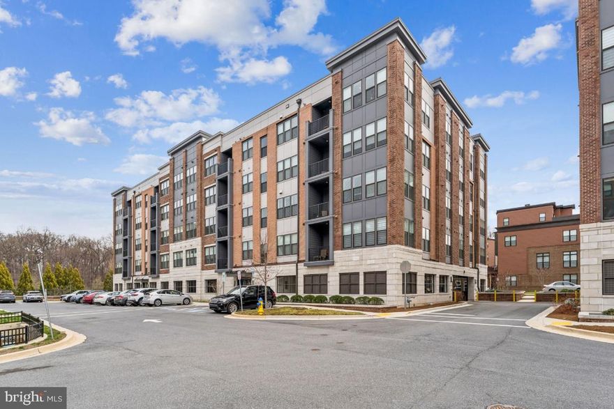 Experience the pinnacle of luxury in this rare, top-floor Declan model—the largest floor plan available—boasting 1,658 square feet of meticulously designed living space within the prestigious Tower Oaks community. Tucked away for a peaceful, quiet lifestyle yet centrally located near I-270, this residence offers the perfect balance of serenity and convenience, situated just a short walk across the street from local landmarks like Clyde’s Tower Oaks Lodge and scenic neighborhood parks. Residents enjoy ultimate peace of mind in a secure building with elevator access, on-site management, and two dedicated tandem spaces in the secured under-building garage. Life here centers around the "CORE" clubhouse, an amenity-rich hub featuring a fitness center, yoga studio, seasonal pool, weekly card games - Hearts and Canasta, weekly Mahjong games, space for arts and crafts and seating nooks for relaxing. Whether you are hosting friends at the community grill stations on heated outdoor patios, attending exclusive "wind down" happy hour events, or grabbing a bite from a visiting food truck, this home offers a sophisticated, walkable retreat designed for those who seek both privacy and a vibrant sense of community.