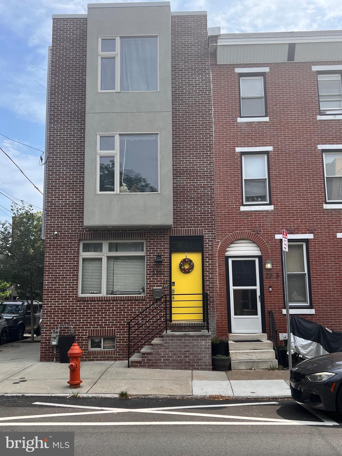 CHECK OUT THE VIDEO TOUR OF THIS PROPERTY AT https://youtu.be/V2NQyFzo4Qk. Welcome to 2201 E. Susquehanna Ave. This stunning, fully renovated classic Philadelphia rowhome is nestled in the vibrant Fishtown area. This stately, corner, 3-story brick gem offers a spacious layout with 3 bedrooms and 2.5 bathrooms across 2,300 sq ft. Laid out for both comfort and style, this is a perfect canvas for modern urban living. The living room has large windows and recessed lighting which highlight the classic, natural toned hardwood floors and an open-plan living area and dining area leading to the elegant kitchen. Here you will enjoy a generous number of rich toned cabinets contrasted by the bright white countertops, stainless steel appliances, and island with sink. Off of the kitchen, are sliding glass doors that lead to your own private backyard oasis complete with custom built seating and storage. Perfect for those summer nights with friends. The second floor features 2 spacious corner bedrooms, a full bathroom, and laundry area. The real treat is on the the third floor. Here you have a primary suite accessed via a barn door. The suite includes a spacious bedroom, full bathroom with walk-in shower, and double sink, and a room sized California Closet that has a huge window and space for a vanity. Climb the spiral staircase to the roof deck with epic, breathtaking views of the city and surrounding area. The high-ceilings in the finished basement create the perfect flex space, ideal for use as a home gym, entertainment area, playroom, family room, or office. The accent wall, recessed lighting, powder room and loads of additional storage in the basement highlight the value this space adds to this home. Central air conditioning, ceiling fans in the bedrooms, gas heating, and modern amenities ensure year-round comfort. Just steps from bustling Frankford Ave, this home places you in the heart of Fishtown’s thriving community. Walk to Konrad Square, top-rated restaurants, art galleries, the city’s best thrift shops and enjoy the music scene at The Fillmore and Frankford Hall among others. Seamless commuting via convenience access to public transportation and an active Uber/Lyft area. Move-in ready, 2201 E Susquehanna awaits your personal signature. Schedule your private tour today—don’t miss the chance to own this exquisite Fishtown residence, where urban energy meets refined comfort.